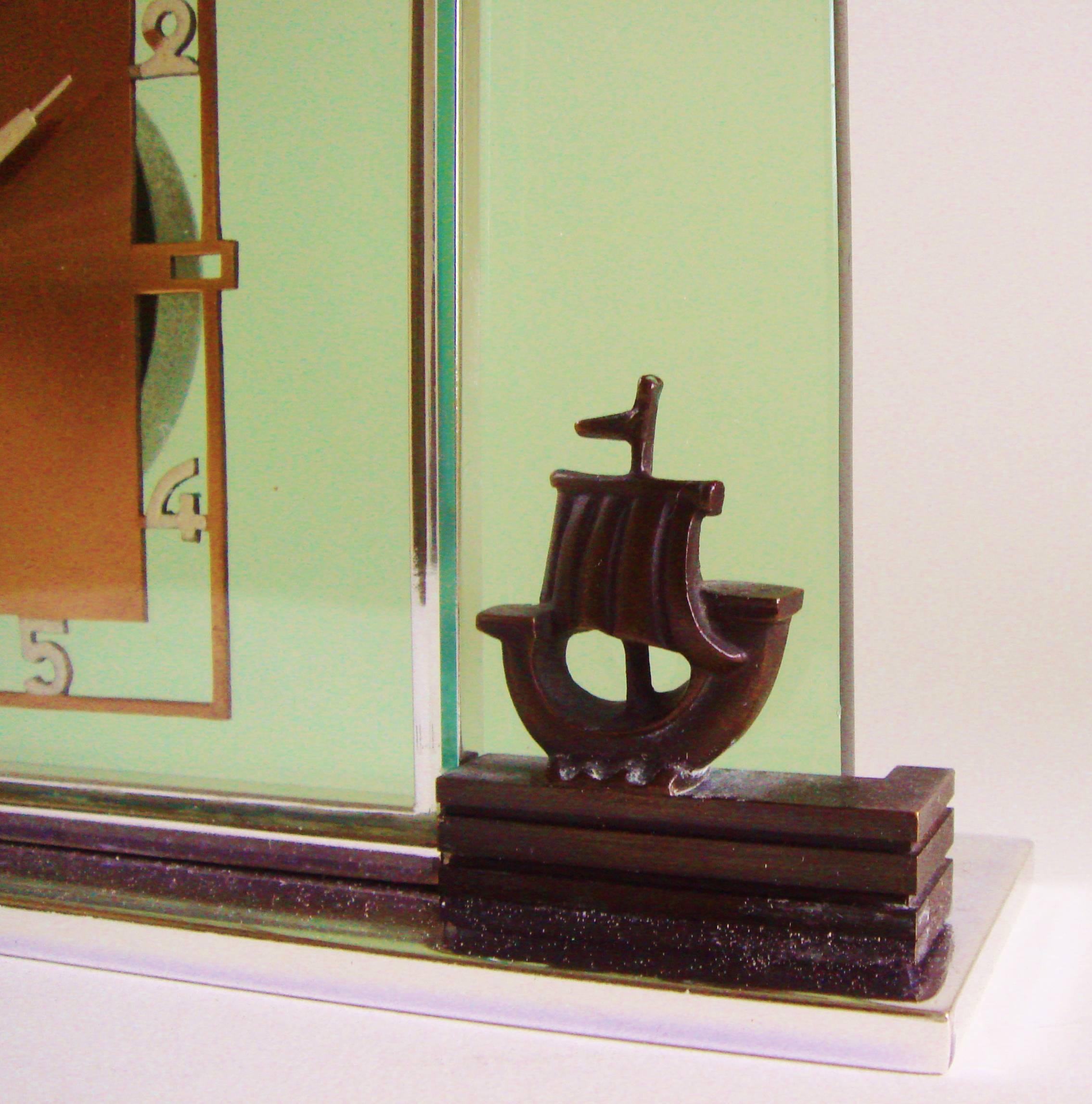 Beveled German Art Deco Glass, Chrome, Copper and Bronze Figural Mechanical Desk Clock