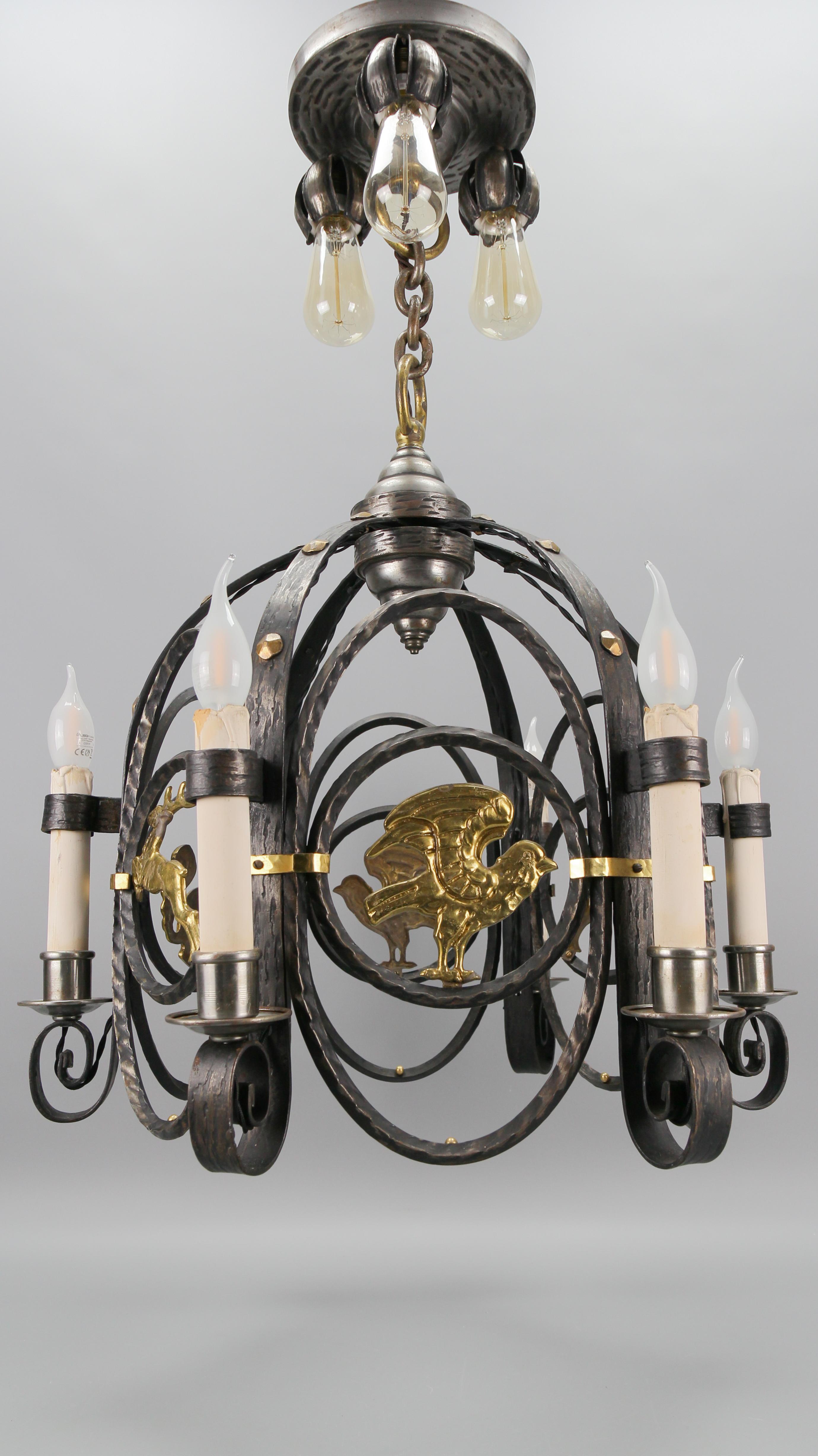 Early 20th Century German Art Deco Nine-Light Wrought Iron and Brass Chandelier with Animals, 1920s For Sale
