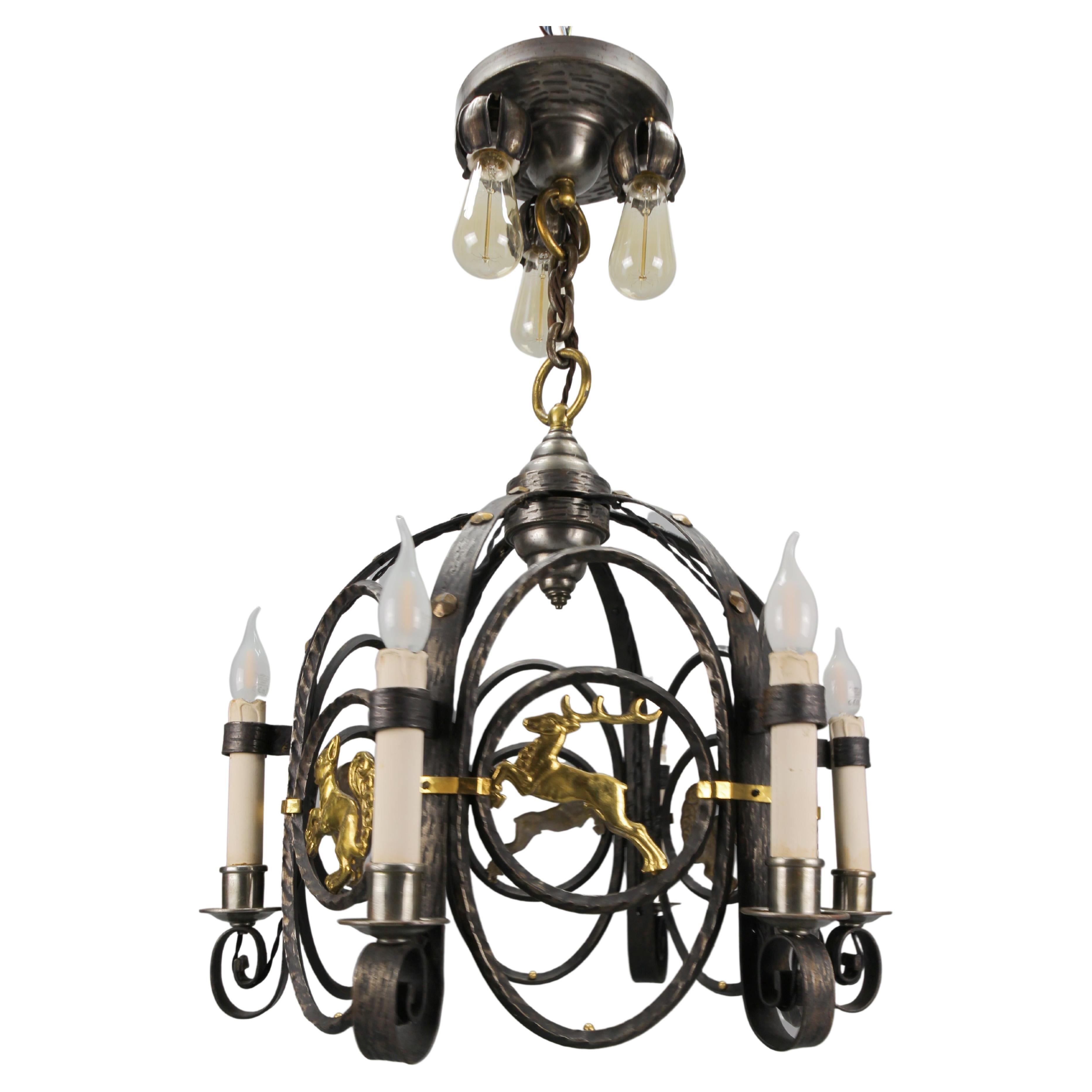 German Art Deco Nine-Light Wrought Iron and Brass Chandelier with Animals, 1920s For Sale