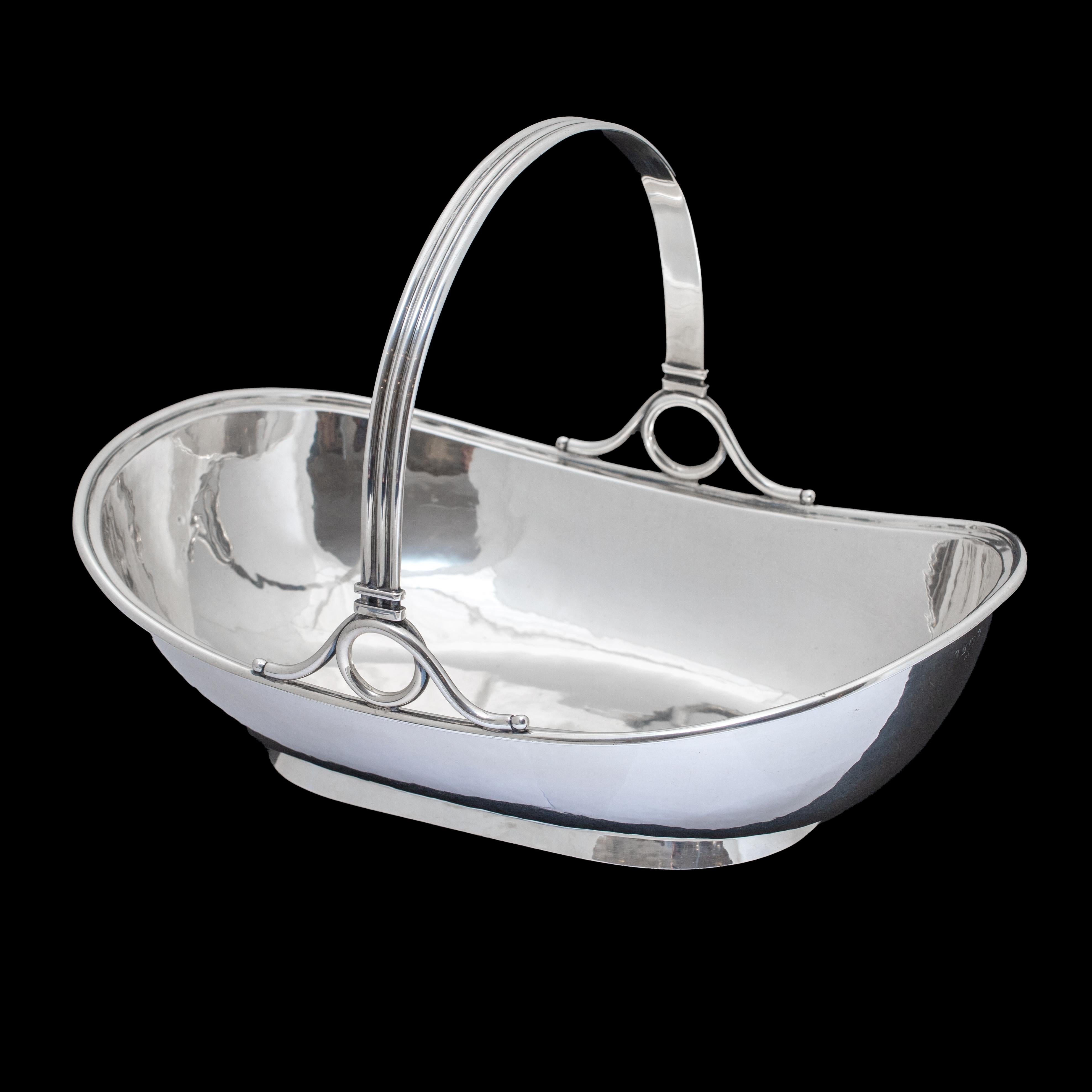German Art Deco Silver Basket, circa 1920s–1930s

A refined German silver basket from the Art Deco period, dating to the 1920s–1930s, measuring 31 x 20 cm and weighing 821 grams. Crafted with clean, modernist lines, this piece embodies the geometric