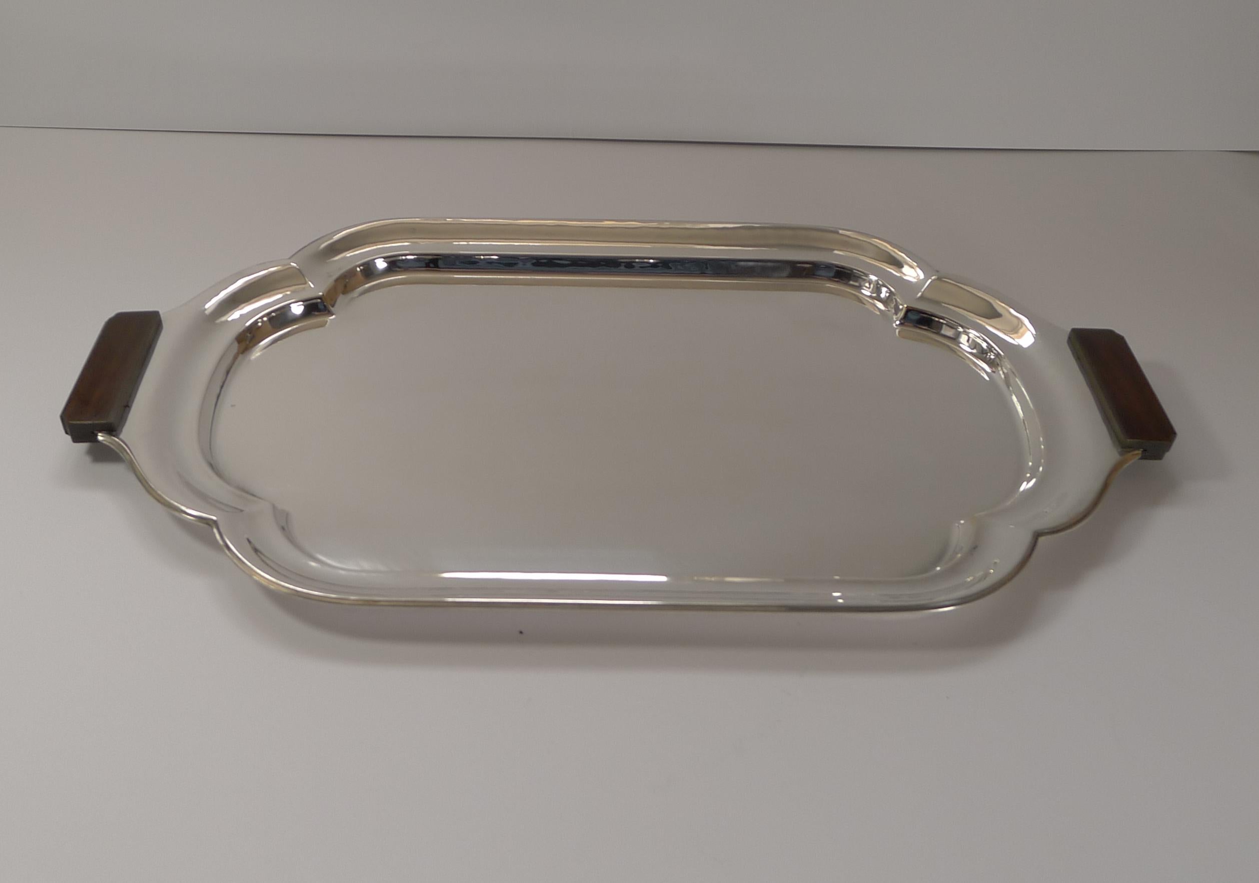 A very smart Art Deco silver plated cocktail / drinks / serving tray made from silver plate having just been through our silversmith's workshop, professionally cleaned and polished to gleam restoring it to it's former glory, dating to c.1930.

It