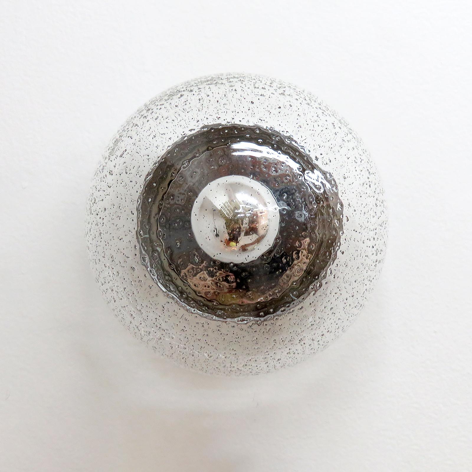 Elegant dome shaped, glass wall light by Hillebrand Leuchten Germany, clear glass shade with graphite inclusions on a chrome reflector/back plate, the design creates a stunning shadow play, can be used as wall or ceiling lights, wired for US
