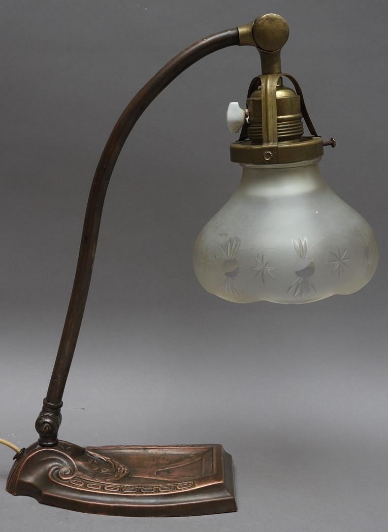 Brass lamp base bronze plated with a hand-cut glass shade and fitted with one porcelain E27 sockets with a rotary switch. Made in Germany about 1900.