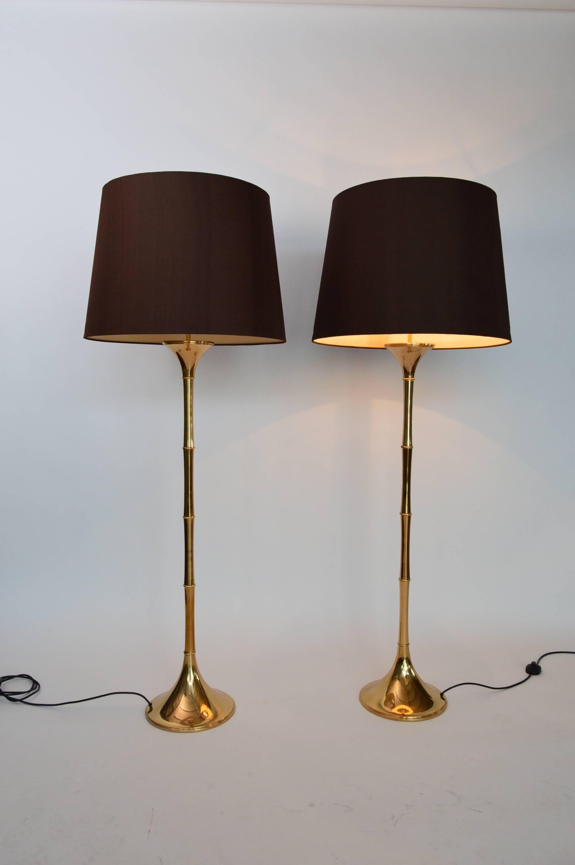 Amazing pair of floor lamps in bamboo optic made in shiny, dark brass with beautiful patina.
Designed from Ingo Maurer, manufactured from MDesign in the 1960s.
The lamps are equipped with original brown lamp-shade in silk and have small signs of