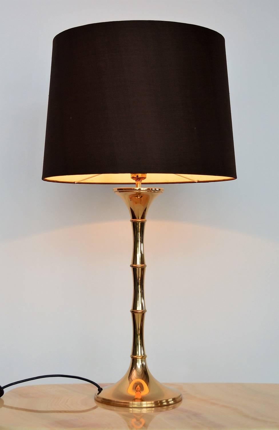 Beautiful table lamp in bamboo optic made in shiny, dark brass with beautiful patina.
Designed from Ingo Maurer, manufactured from MDesign in the 1960s.
The lamp is equipped with original brown lampshade in silk. It could be redone as