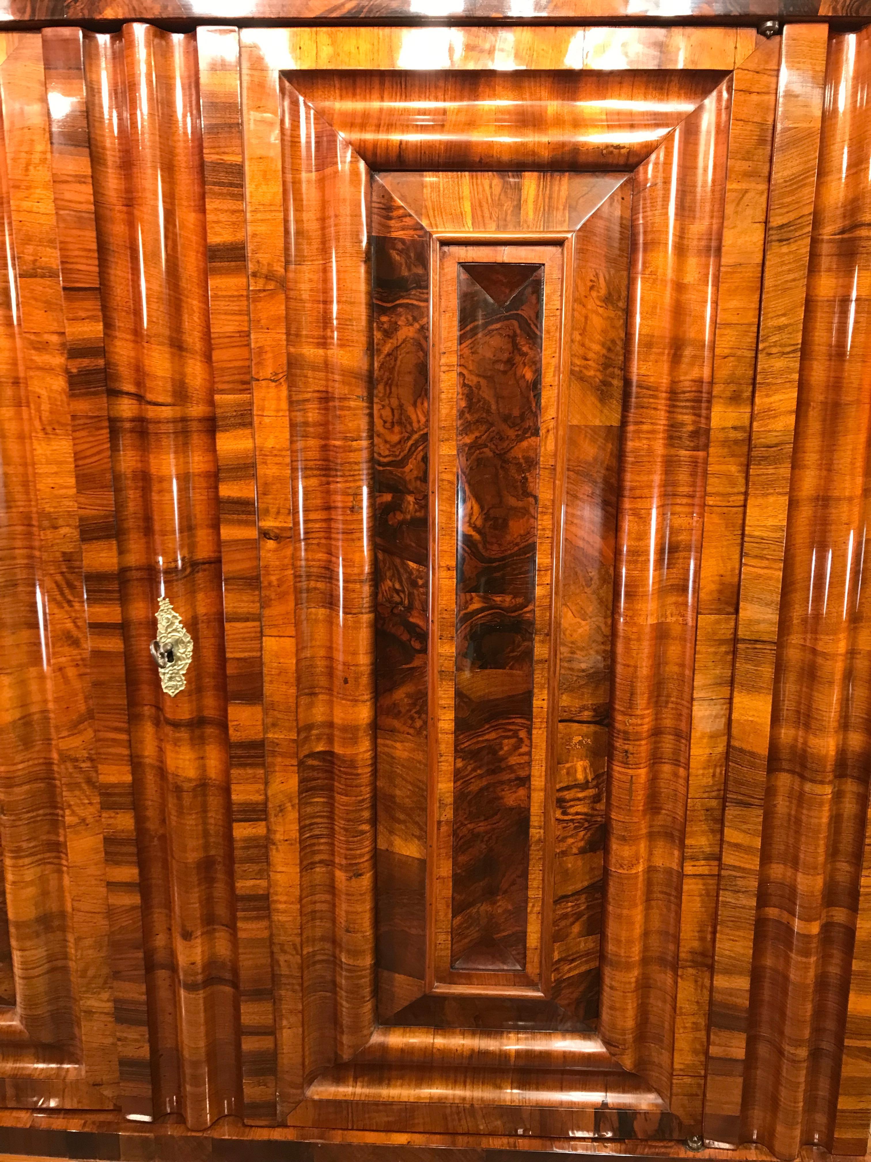 Frankfurter Wellenschrank, German Baroque Armoire 1730
Exquisite Frankfurter Wellenschrank made around 1730. The name Wellenschrank  (meaning “wavy cabinet”) refers to the defining feature of its three-dimensional, wave-like front panels. This