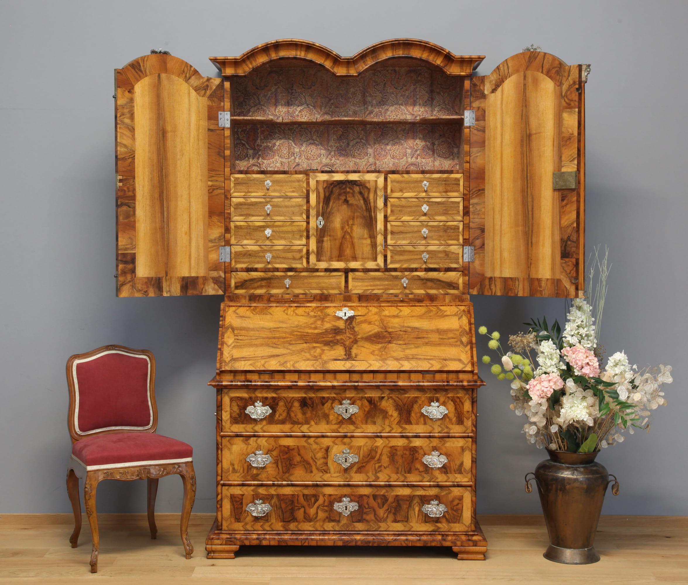 Two-piece baroque secretary with mirrored doors, exceptional original silvered fittings with numerous princely crowns, walnut saw veneer on softwood, Thuringia circa 1730/35. This secretary comes from princely property, was made in very high