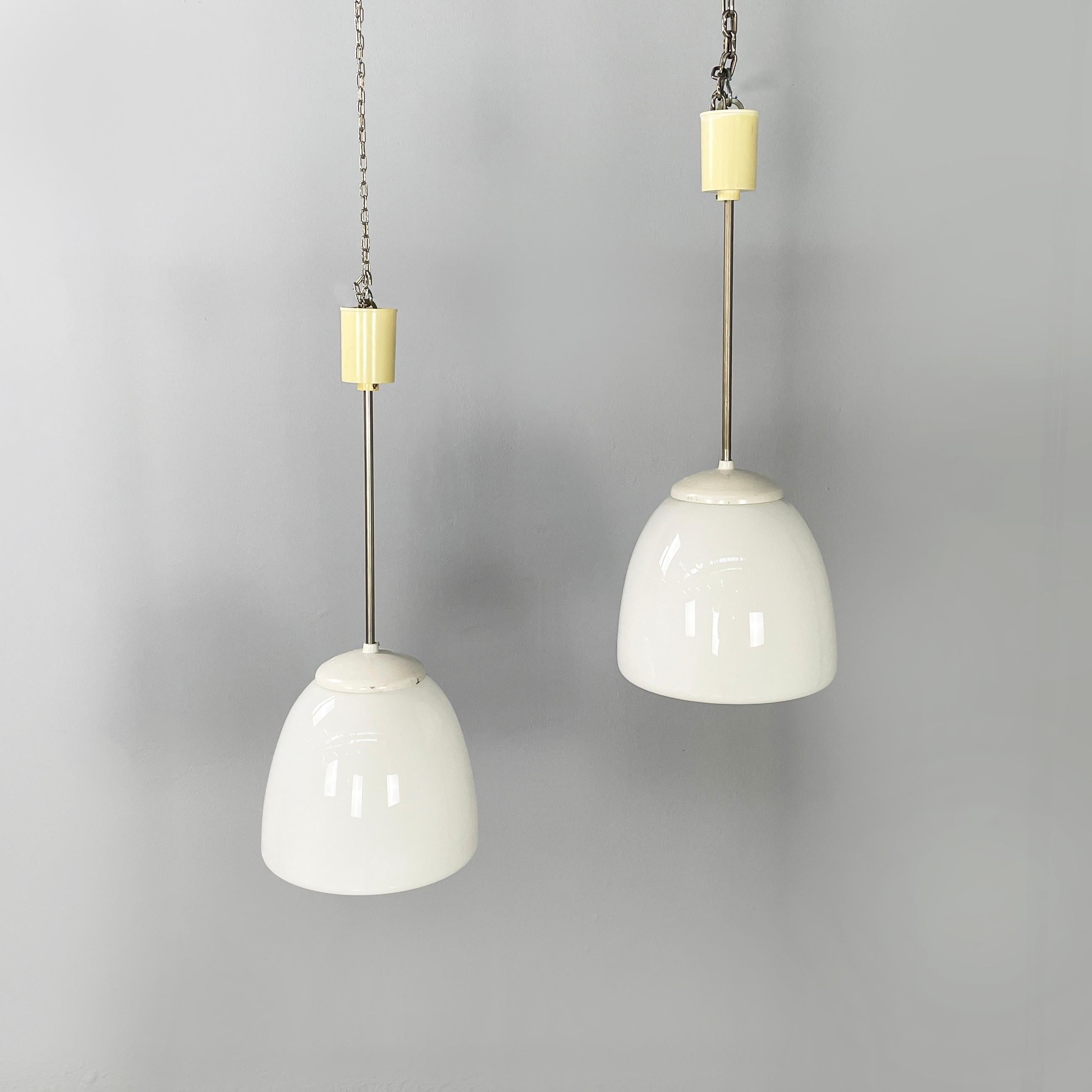 German Bauhaus style Chandelier in opaline glass, white plastic and metal, 1920s
Pair of chandeliers with dome diffuser entirely in opaline glass. Then round attachment to the structure is in white plastic. The structure of the lamp is made of metal
