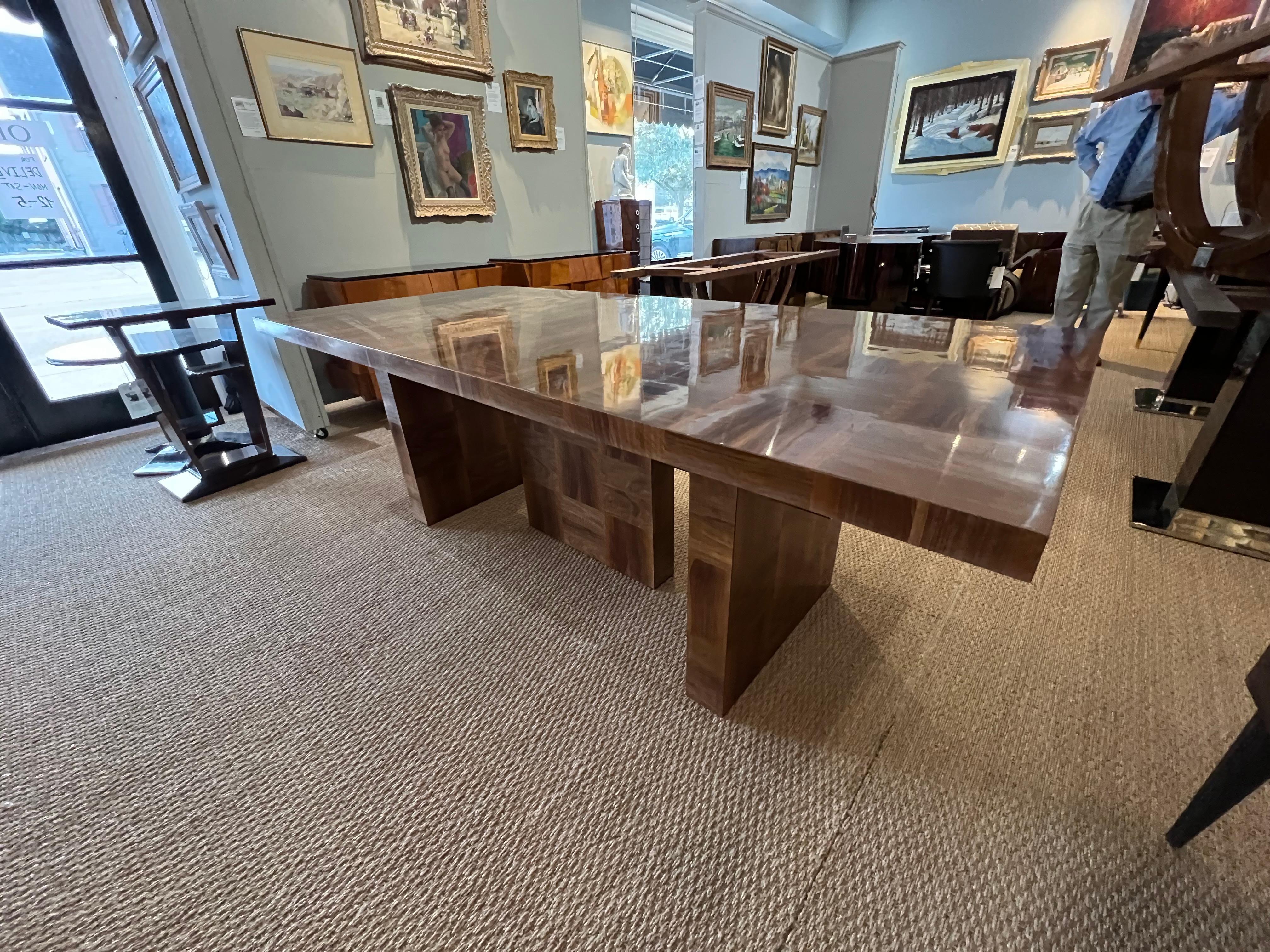 Beautiful dinning room table from Bauhaus are. Made in Germany, c. 1950s
Table top is composed our of square shape walnut pieces. Top is resting on the prominent base that is composed out of 3 walnut rectangles with wood spheres on top. There is