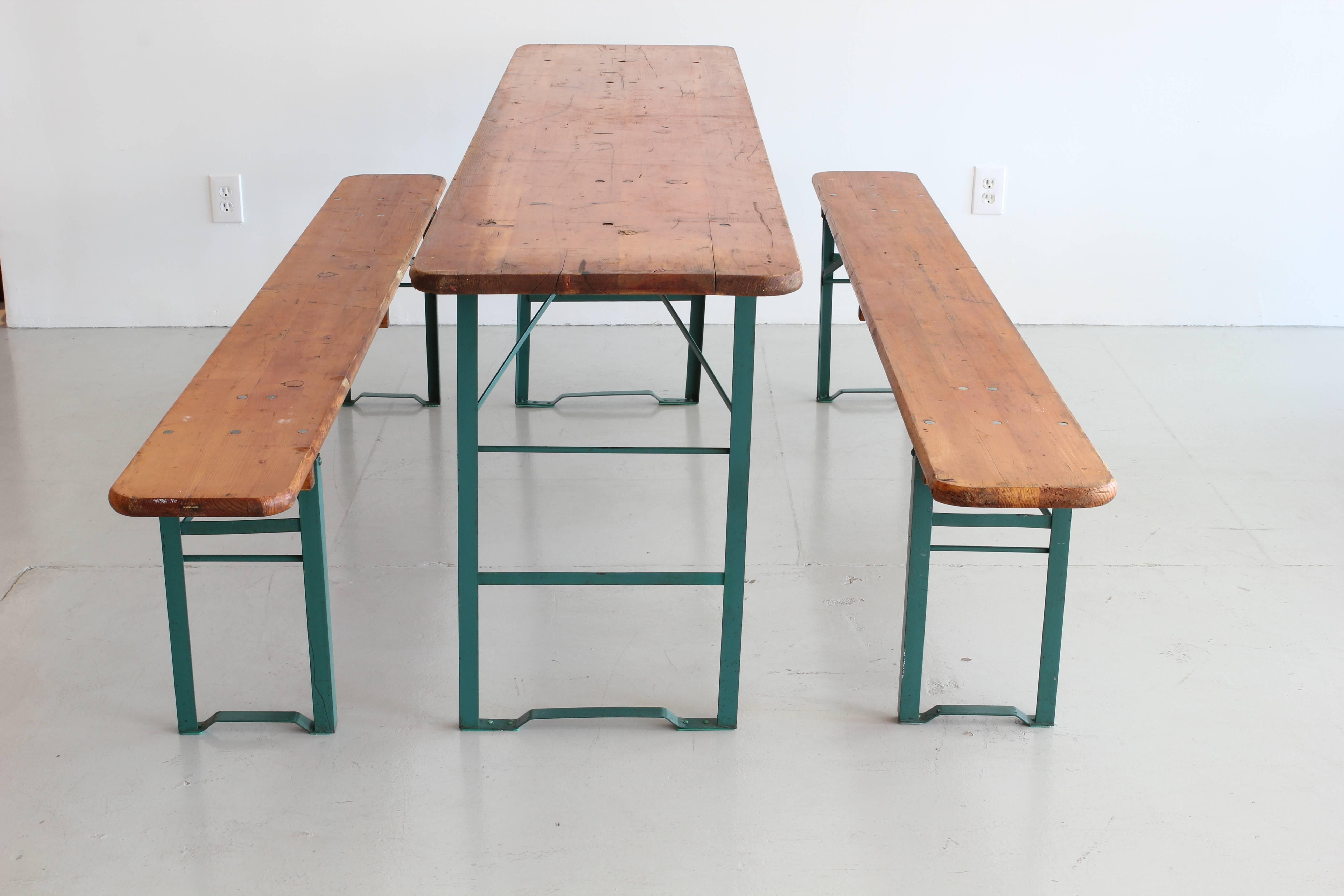 German Beer Garden picnic table with green metal legs and wood top.
Great patina and heavy construction.
Includes table and two benches.
 