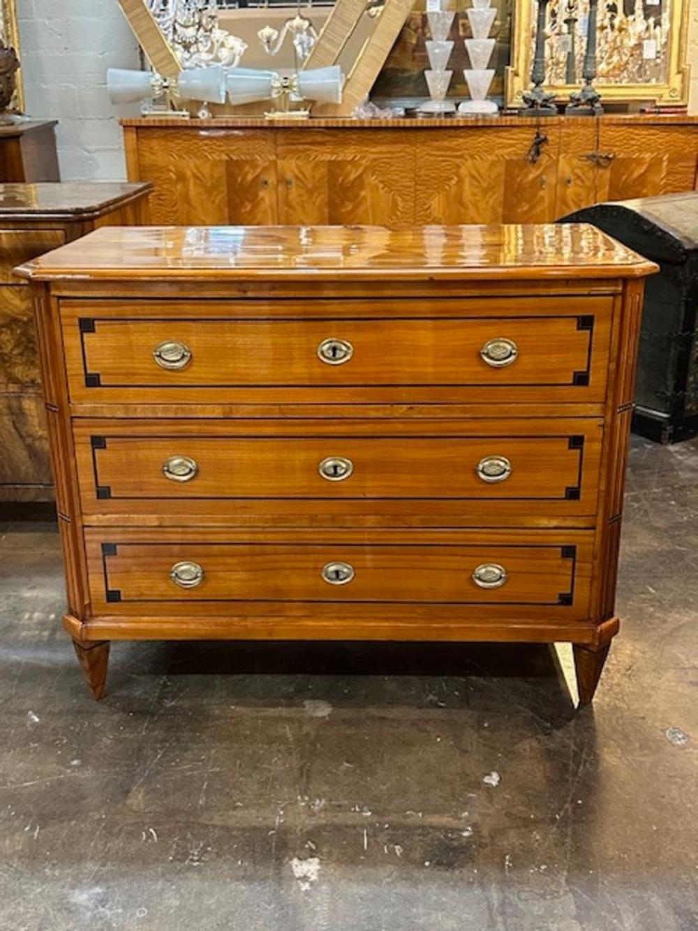 Handsome 19th century German Biedermeier cherry wood and ebony inlay commode. Circa 1840. A fine addition to any home!