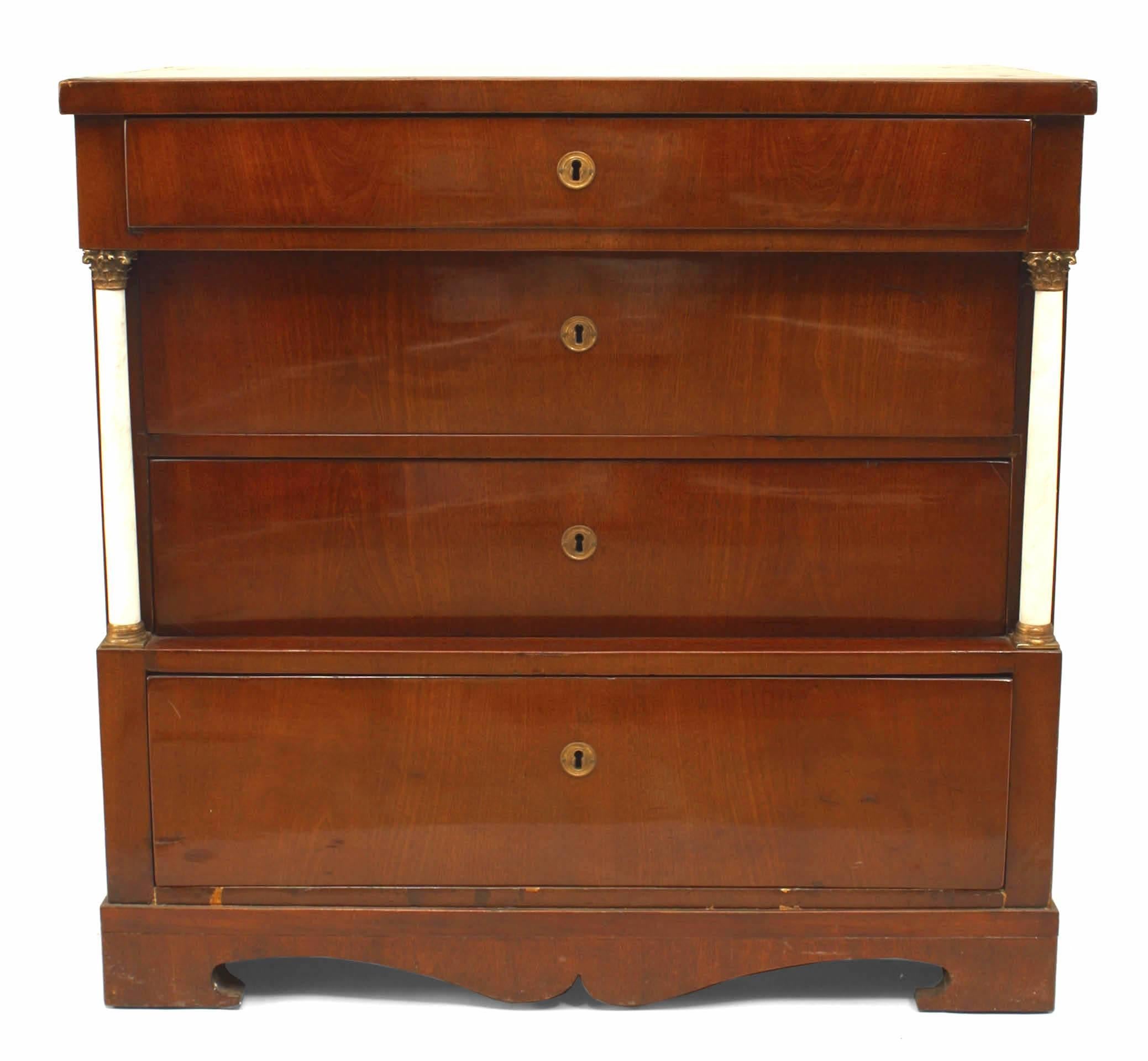 German Biedermeier (19th Century) mahogany chest of drawers with marble column sides.
