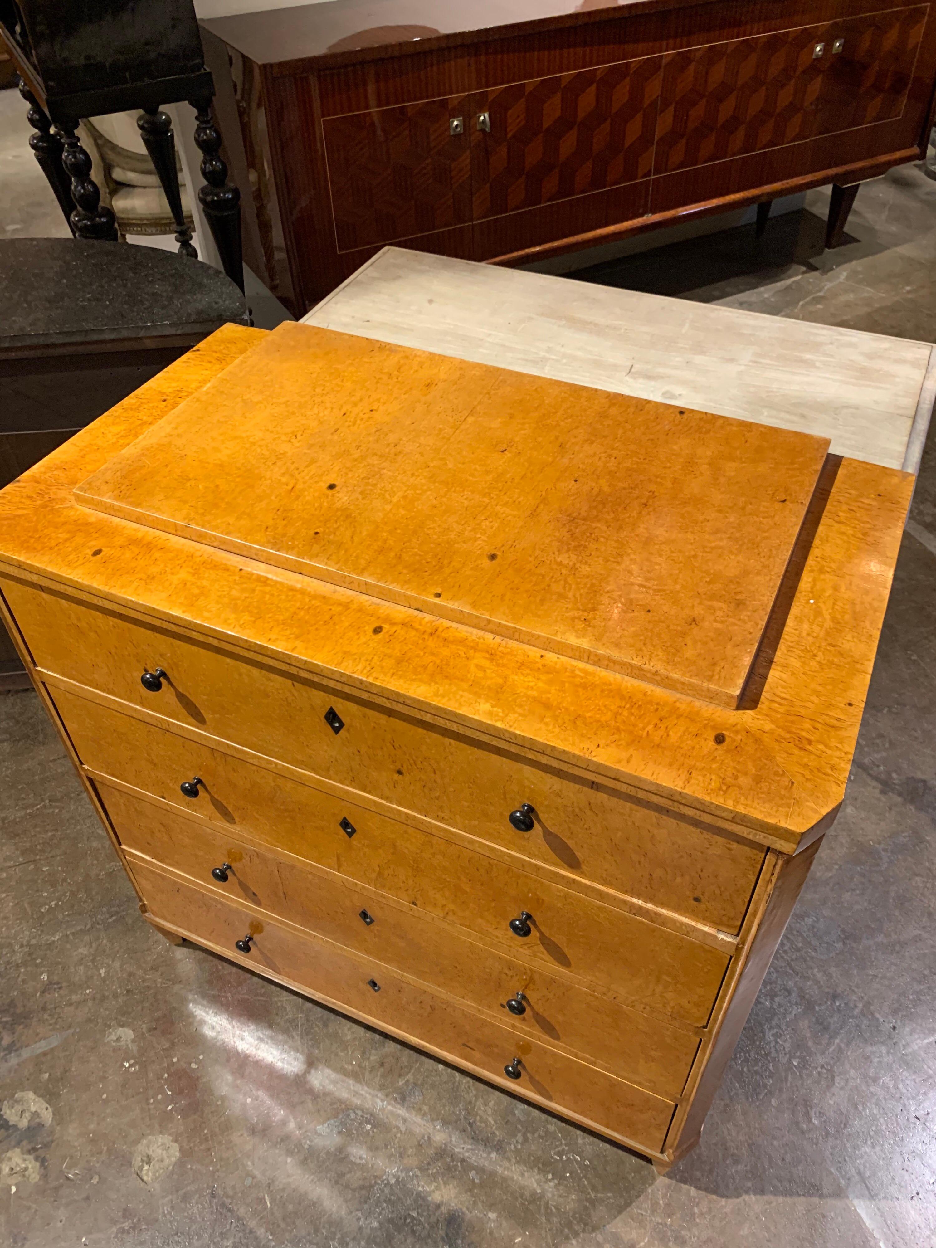 Very handsome German Biedermeier style burl wood chest of drawers with ebony knobs. Lovely Classic sophisticated style makes this a beautiful design element. A quality piece with an amazing finish!