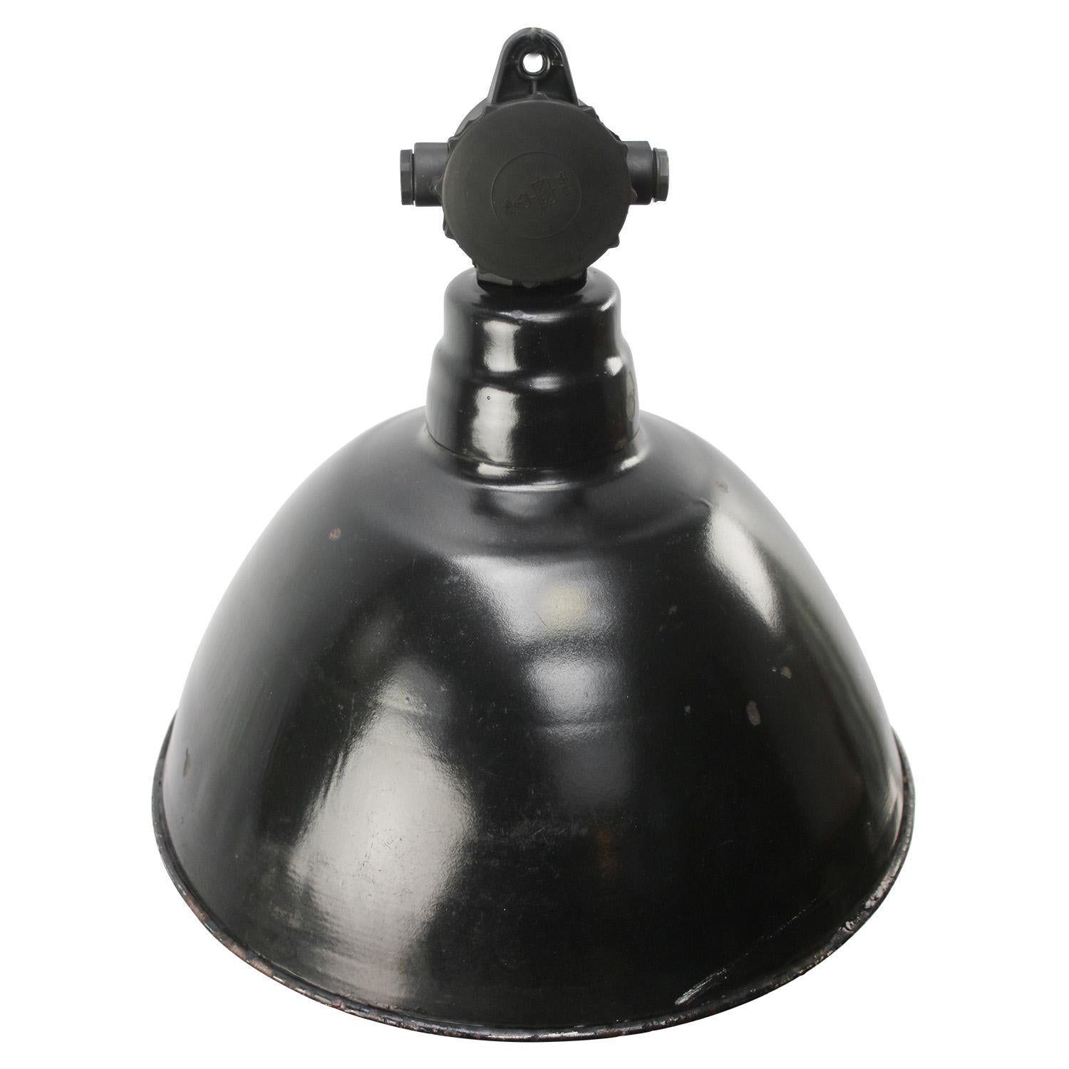 Vintage German industrial pendant light.
Used in warehouses and factories in Germany.
Black enamel top with Bakelite top.

Weight: 2.2 kg / 4.9 lb

Priced per individual item. All lamps have been made suitable by international standards for