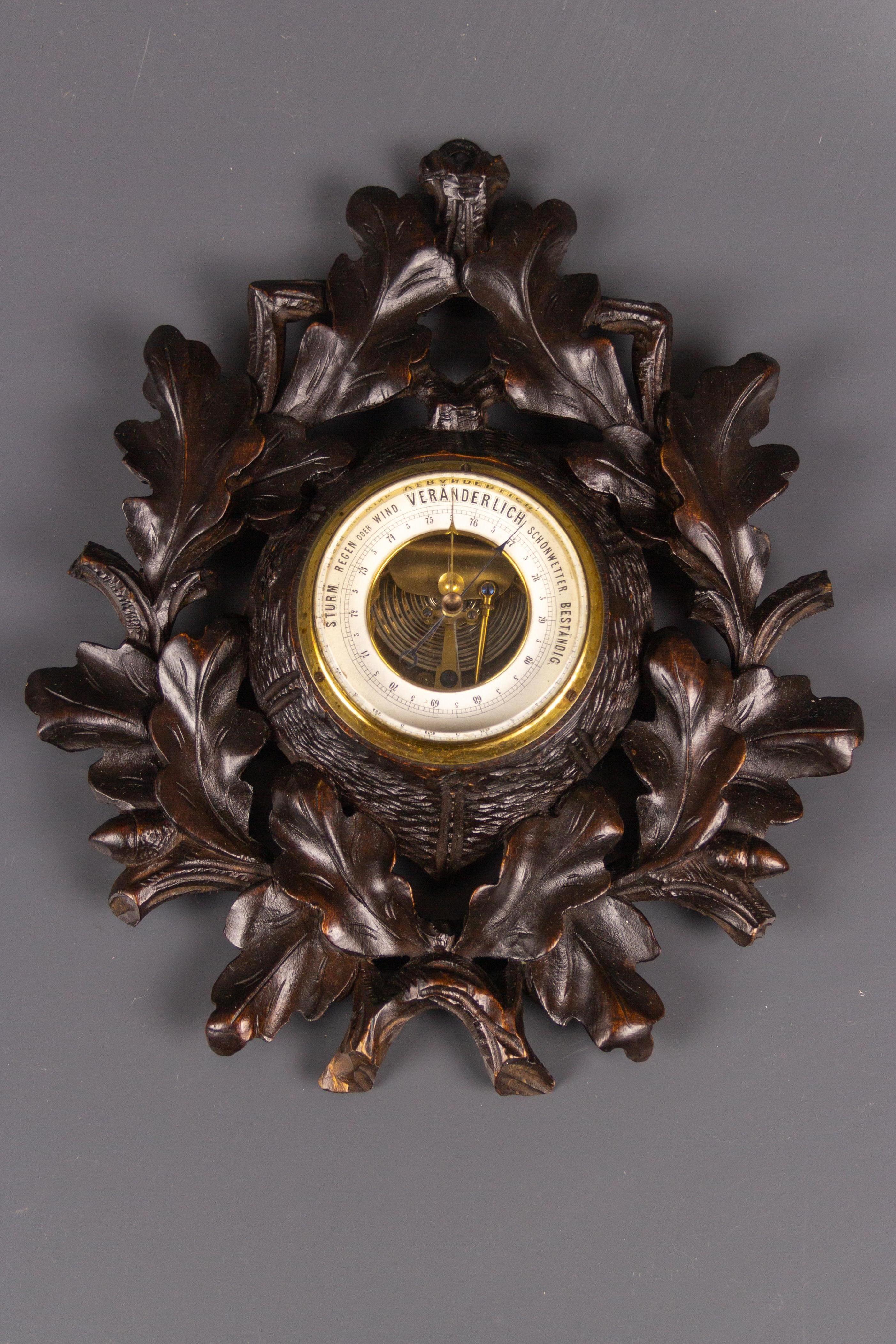 German Black Forest style barometer with fine hand-carved oak branches, leaves, and acorns.
Dimensions: height 30 cm / 11.81 in; width 24 cm / 9.44 in; depth 5 cm / 1.96 in.
In good condition with slight signs of aging.