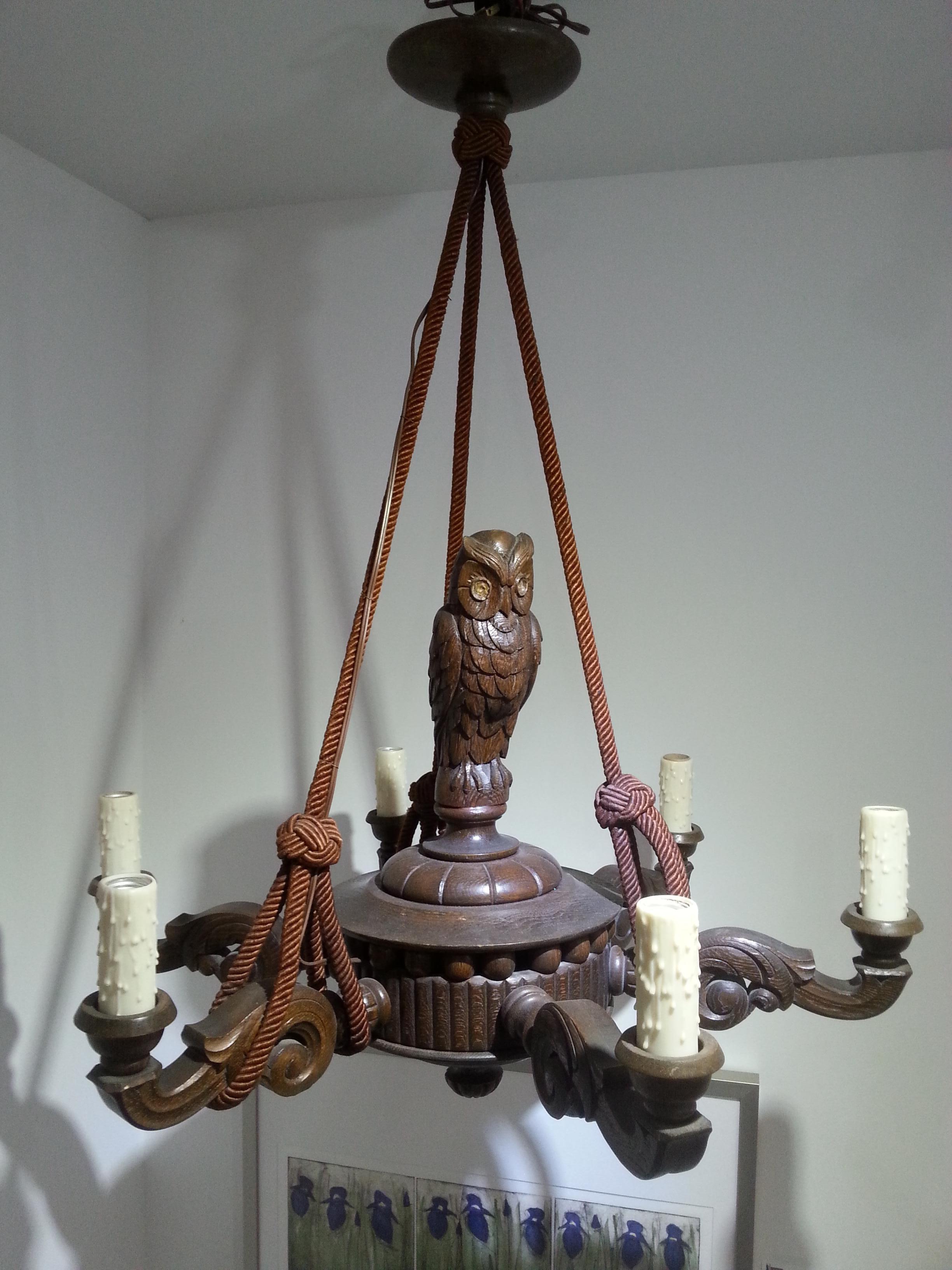 This stylish and chic German Black Forest chandelier dates to the 1920s-1930s and is hand carved.