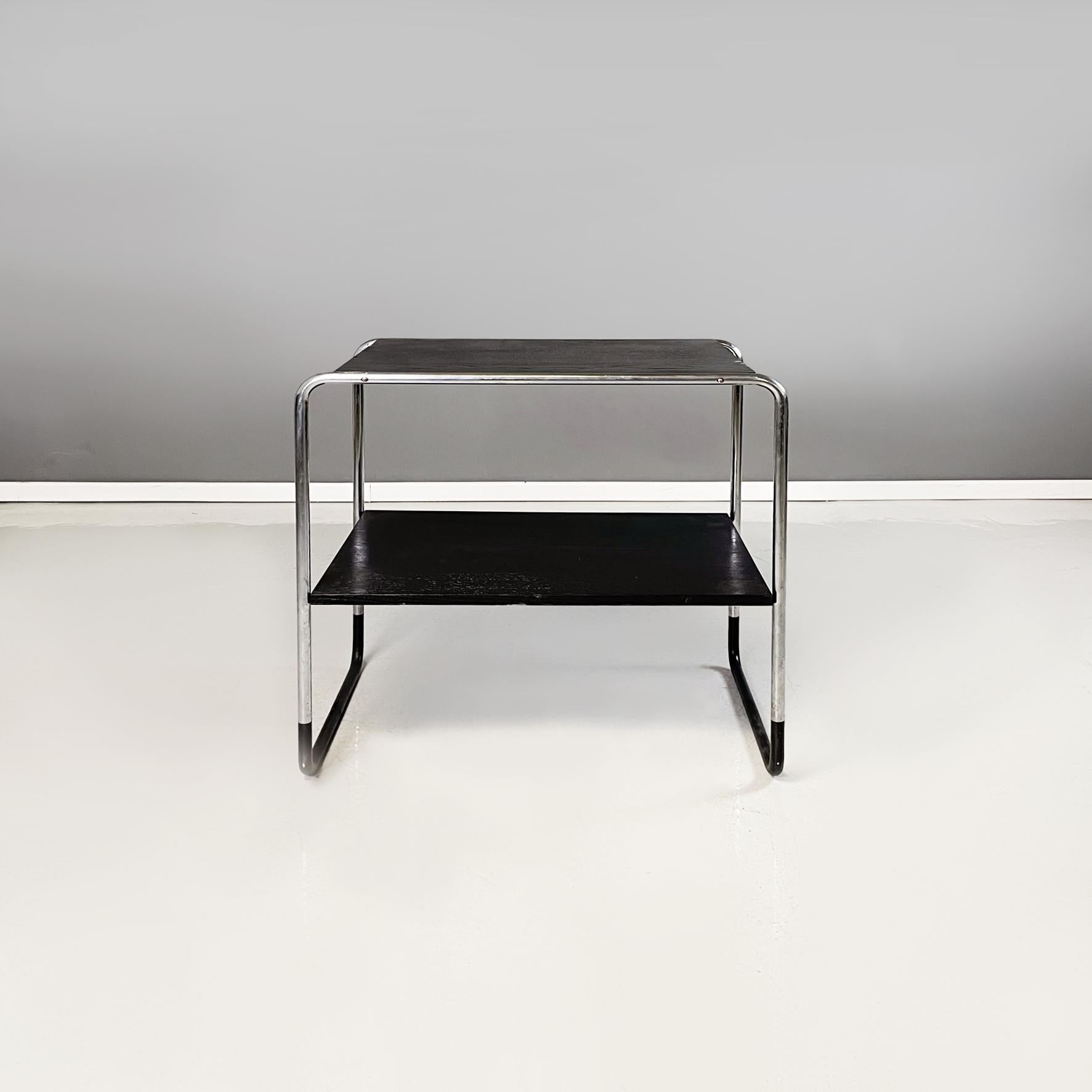 German modern Black wood and steel Coffee table by Arnold Bauhaus Collection, 1980s
Coffee or side table with double rectangular shelf in black painted wood. The structure is in tubular steel, with a black finish at the base. It also can be used as