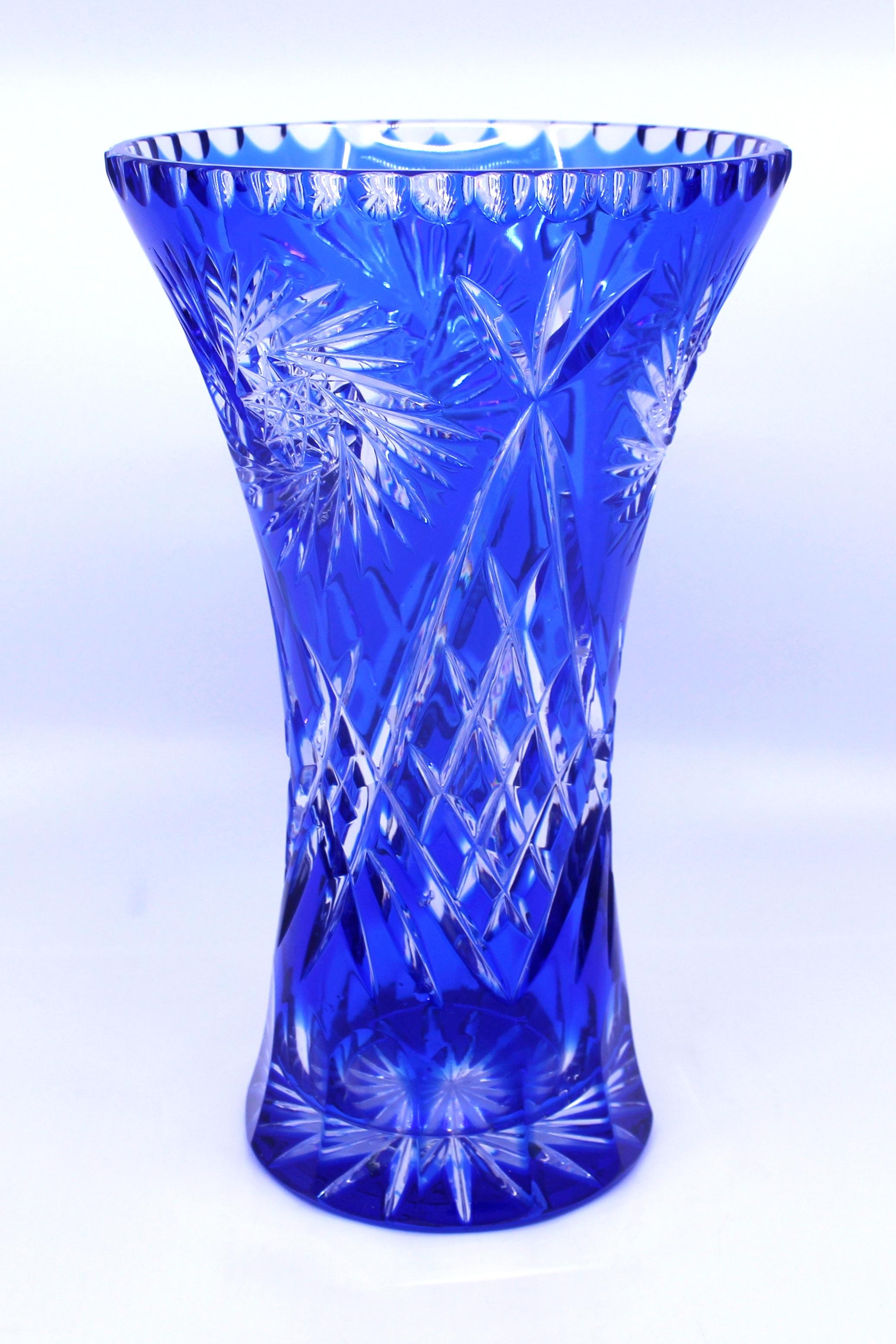 German blue overlay crystal 10 inch flower vase

Origin 
German

Composition 
Cut overlay crystal, blue

Condition 
Very good condition commensurate with age. No chips, cracks or repairs. Light scratches to base commensurate with age
 

