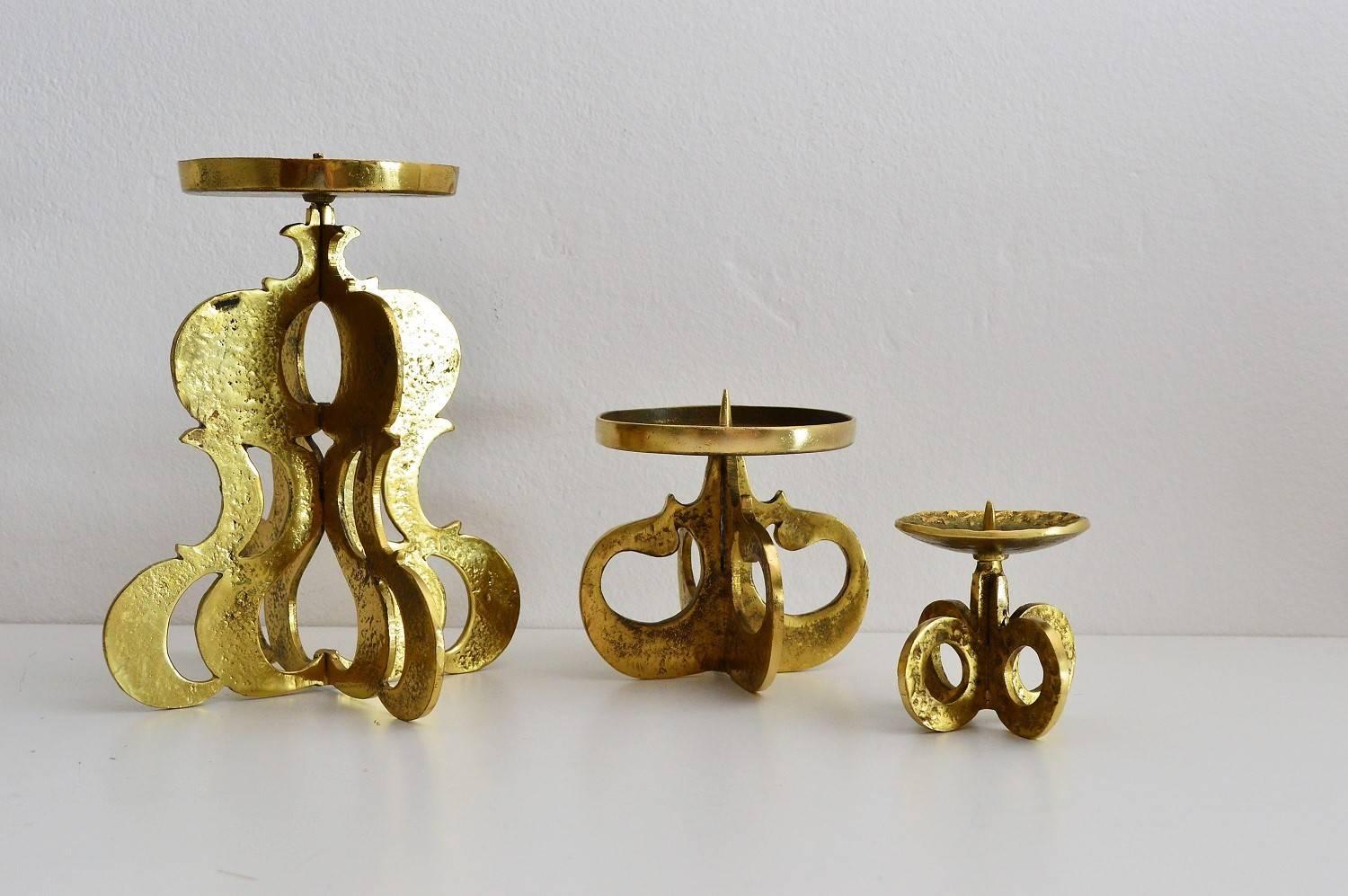 Beautiful set of three candlestick holders in massive brass.
Made in Germany in the 1970s.
The candleholders are of different size and form; all three are hand made and heavy.
Excellent condition.
The sizes of the two smaller ones are:
H 12 cm,