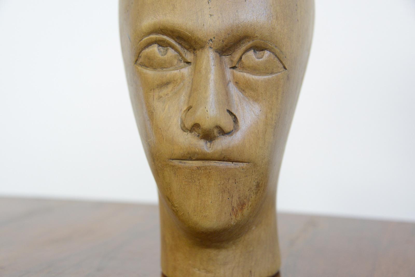 German carved wooden milliners head, circa 1910

- Hand carved from sycamore
- Used in the displaying and making of hats
- German, 1910
- Measures: 25 cm tall x 15 cm wide x 18 cm deep

Condition report

Signs of its previous in the form of