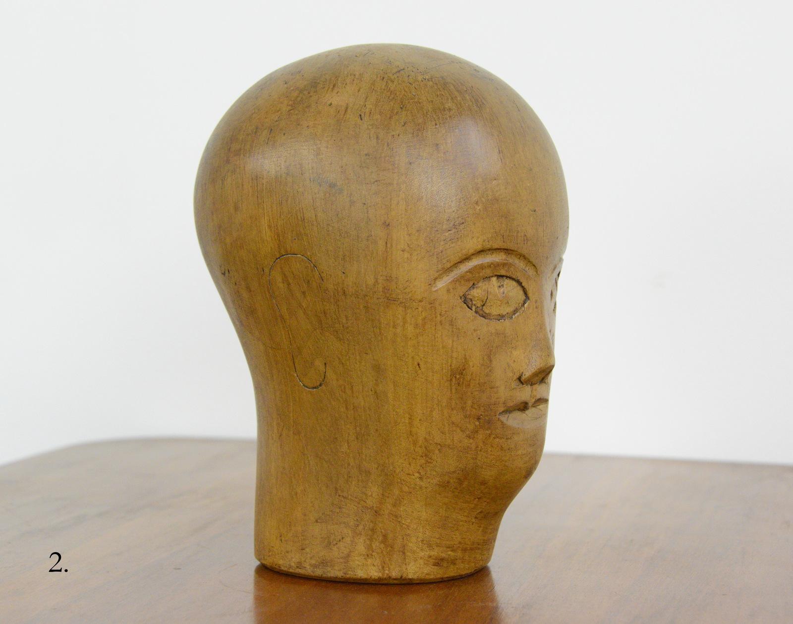 German carved wooden Milliners head circa 1920

- Hand carved from sycamore
- Used in the displaying and making of hats
- German ~ 1920
- Measures: 25cm tall x 15cm wide x 18cm deep

Condition report

Signs of its previous in the form of