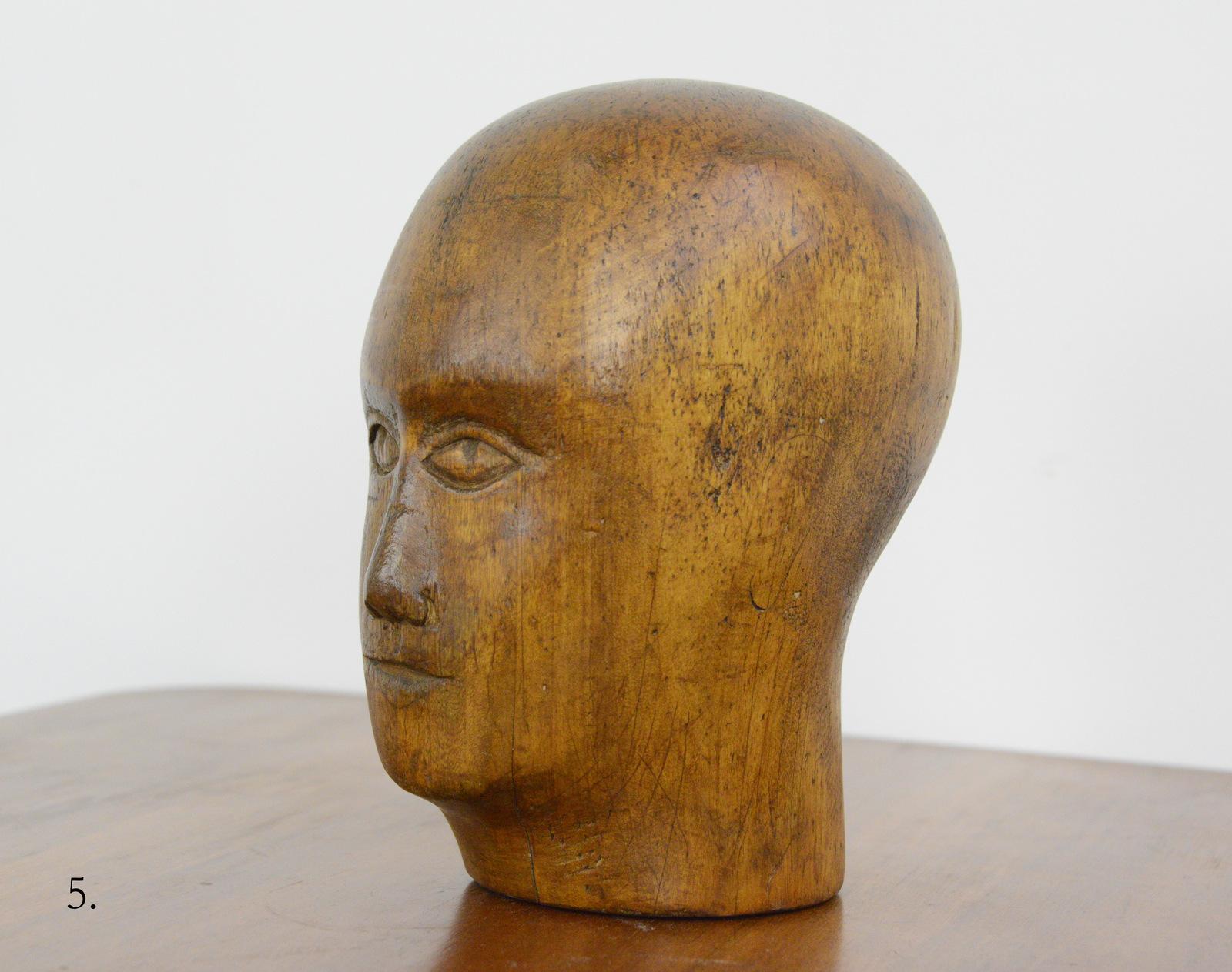German carved wooden milliners head, circa 1920

- Hand carved from sycamore
- Used in the displaying and making of hats
- German ~ 1920
- Measures: 25cm tall x 15cm wide x 18cm deep

Condition report

Signs of its previous in the form of