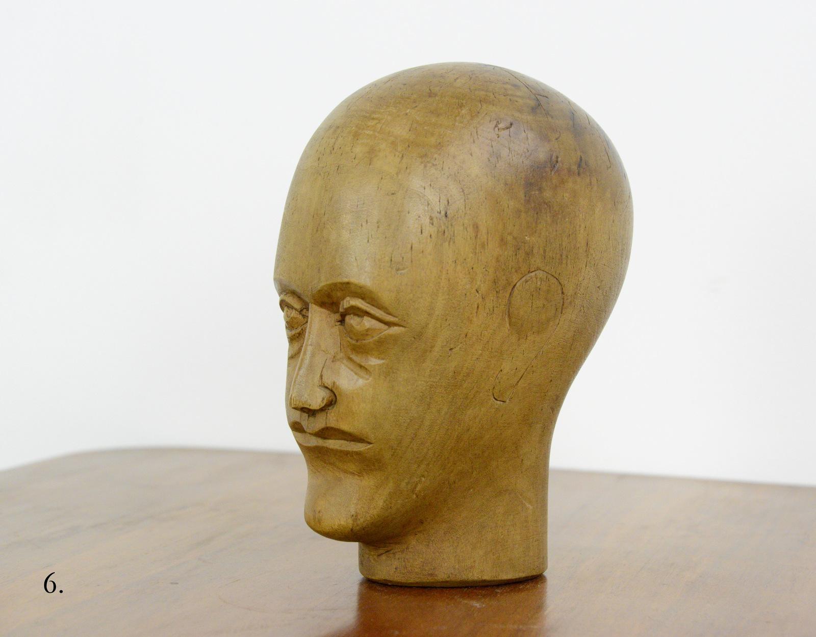 German carved wooden milliners head, circa 1910

- Hand carved from sycamore
- Used in the displaying and making of hats
- German, 1910
- Measures: 25 cm tall x 15 cm wide x 18 cm deep

Condition report:

Signs of its previous in the form