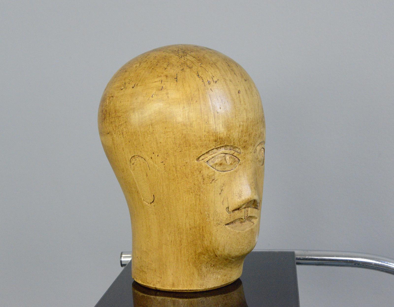 German carved wooden Milliners head circa 1920

- Hand carved from sycamore
- Used in the displaying and making of hats
- German, 1920
- Measures: 25cm tall x 15cm wide x 18cm deep

Condition report

Signs of its previous in the form of pin