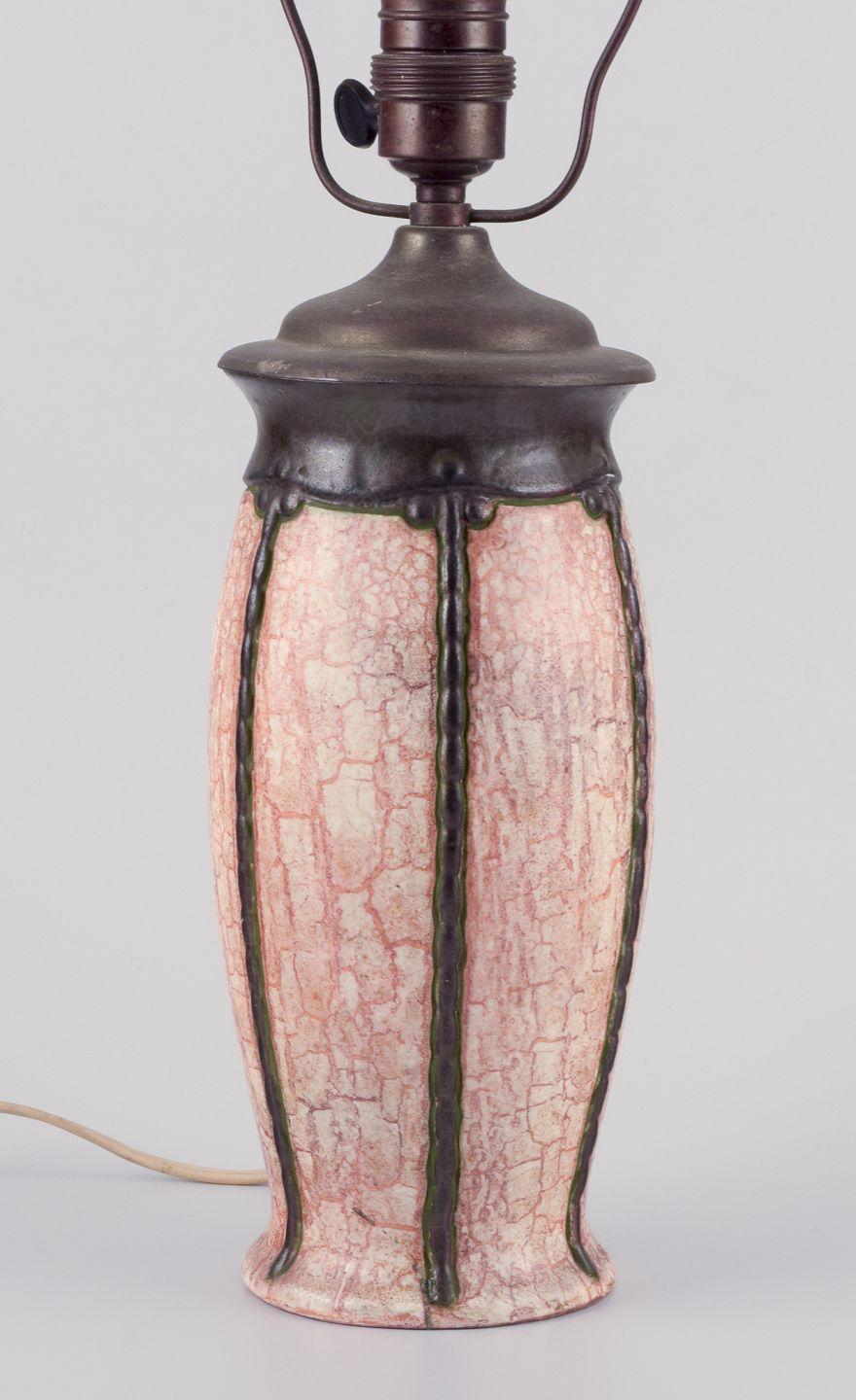 PRE-OWNED GOODS ARE EXEMPT FROM IMPORT TARIFFS FOR U.S., UK, AUSTRALIAN & CANADIAN CUSTOMERS.   
THEREFORE, NO IMPORT TARIFFS WILL BE APPLICABLE TO YOUR PURCHASE. 

German ceramicist. Art Nouveau table lamp made of ceramic.
Glaze in light and