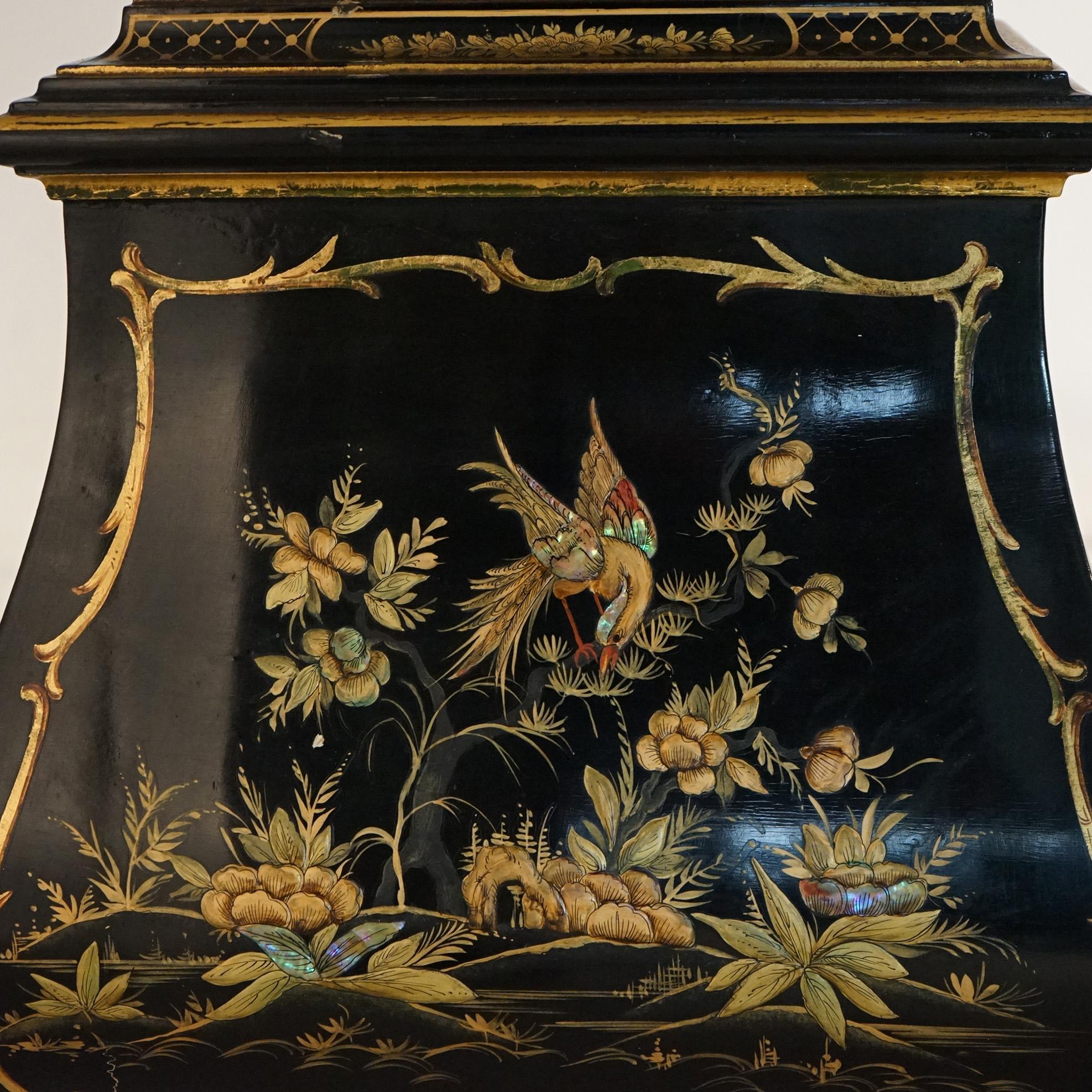 ***Ask About Reduced In-House Shipping Rates - Reliable Service & Fully Insured***
A German petite tall case clock offers bombe base, black lacquer finish with gilt chinoiserie decoration throughout, and maker stamp with serial number as