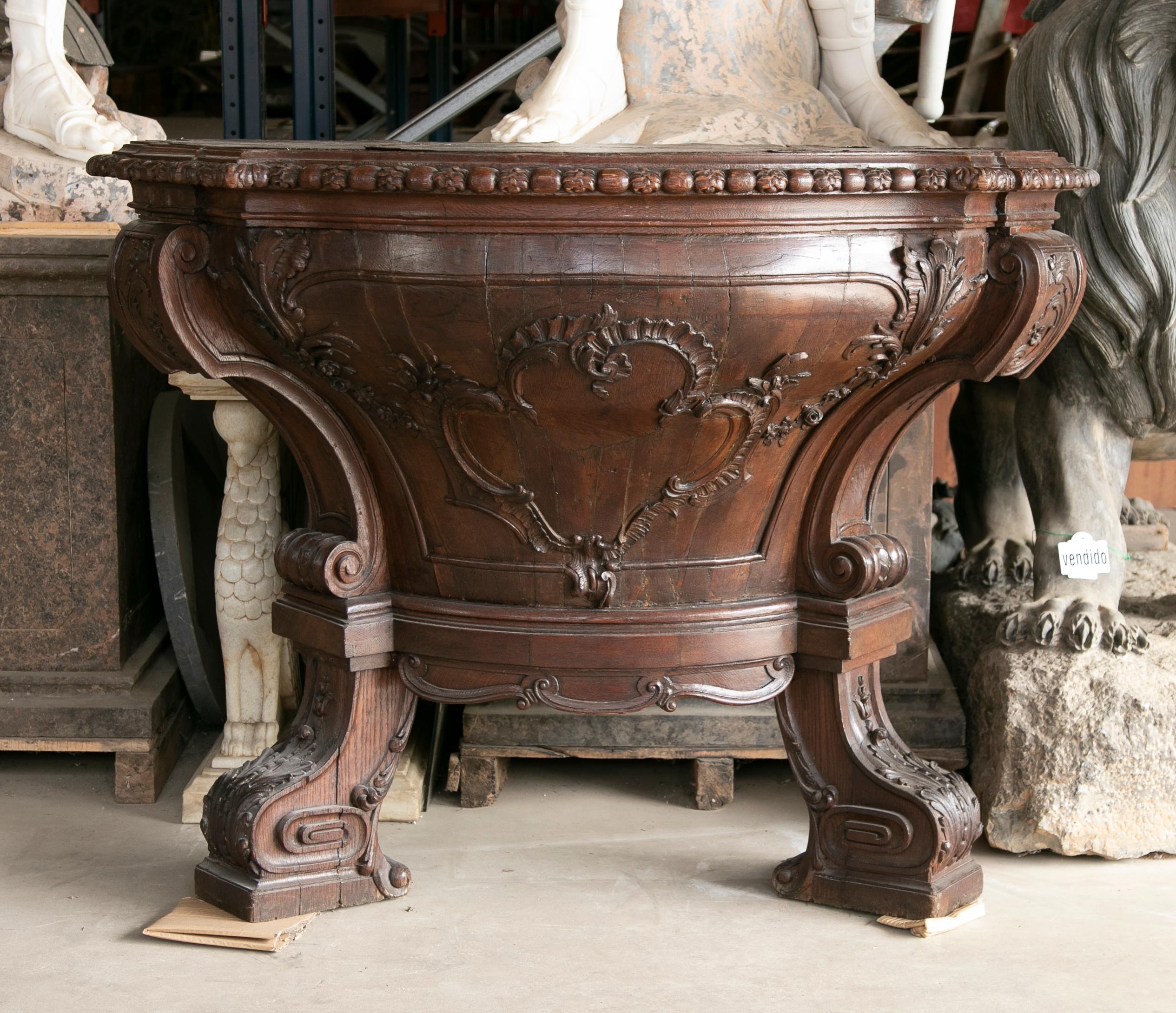German console handcarved in wood with Cordoban top.