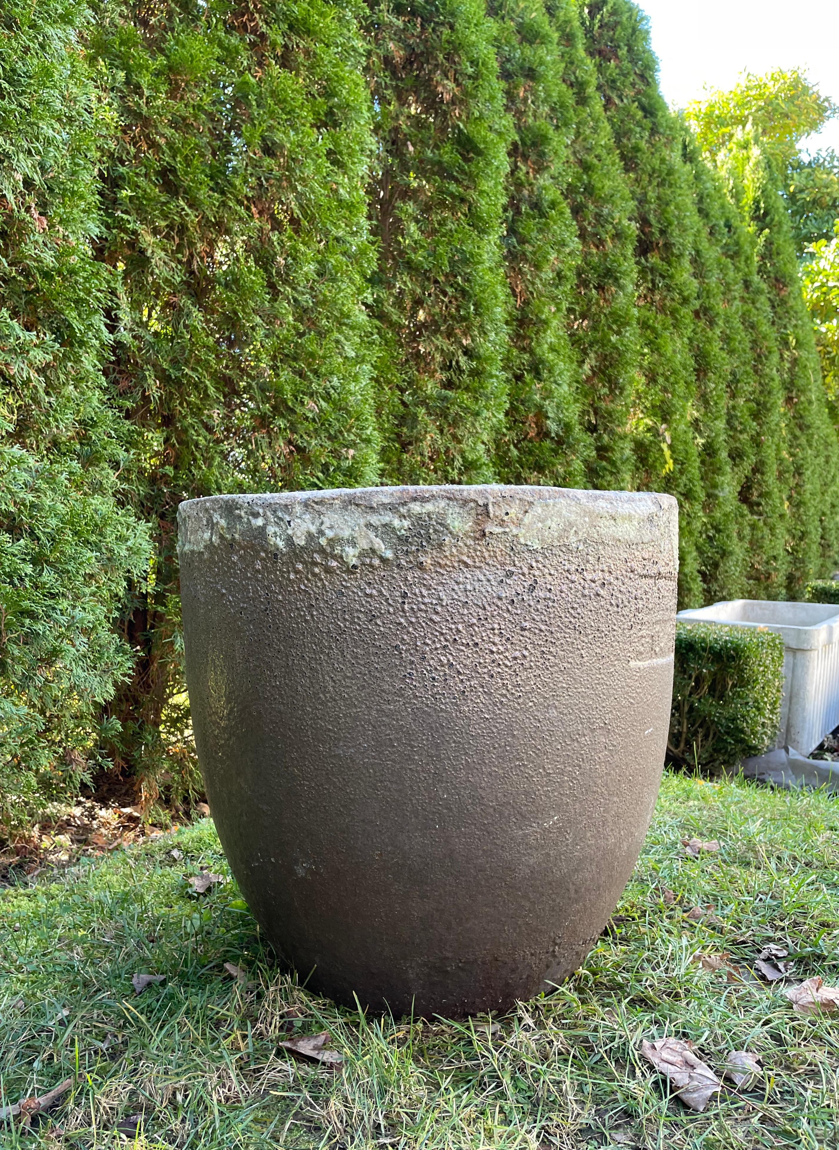 Crucibles have been used through history to smelt metal and other substances, but the ceramic ones make outstanding planters (and fire pits). This one has a dark mottled coppery-colored hue with a subtle sheen to the surface and a commodious