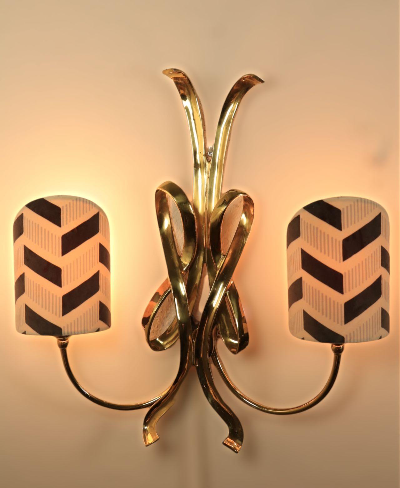 Very high quality golden wall lamp with newly made velvet lamp shades. 
Opulent style. Great for a mix with e.g. minimalist furniture.
Brass and velvet.
 
By Hans Möller (see label on the back), Germany.
Handcrafted and limited edition.
