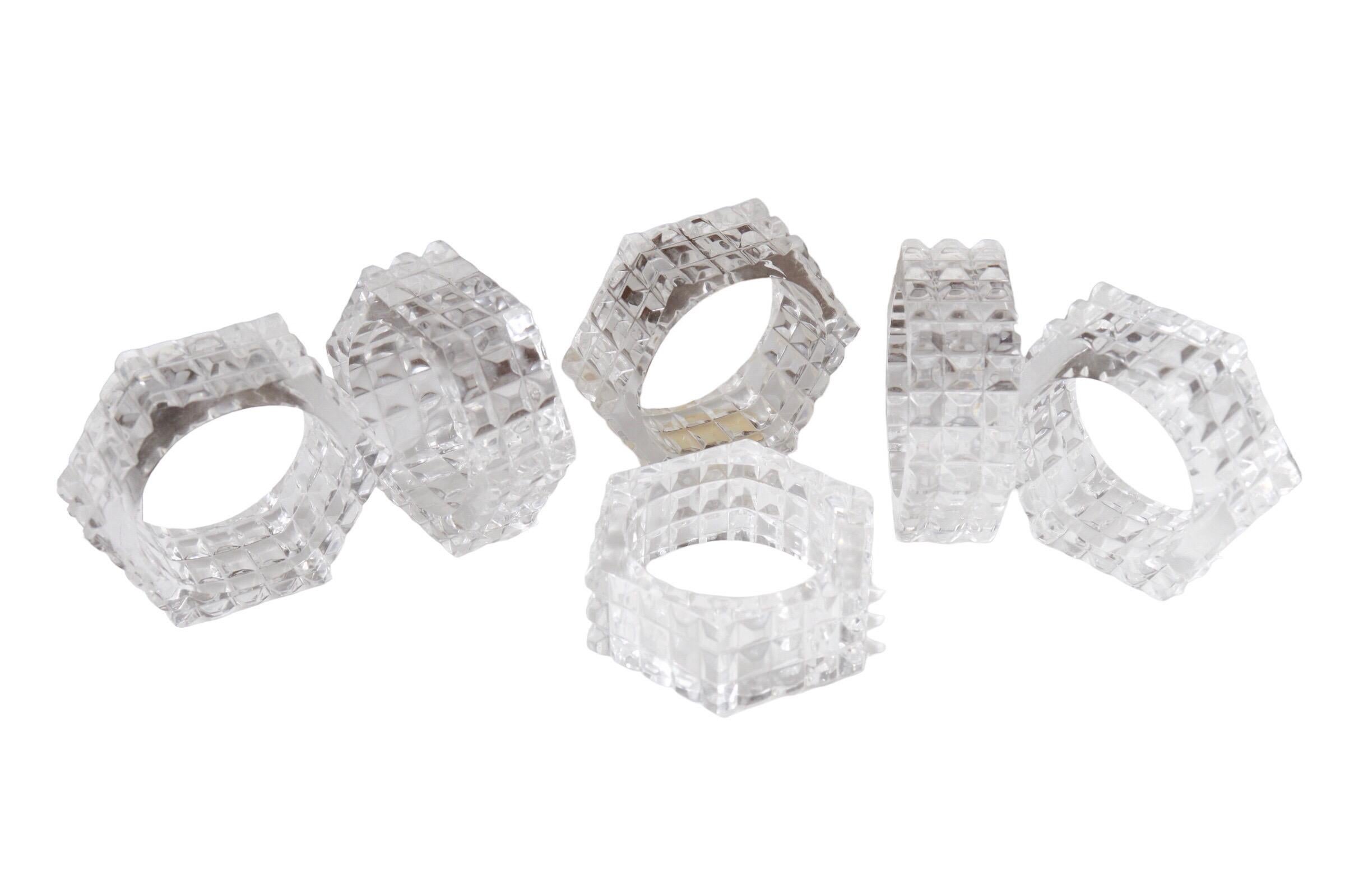 A set of six block cut lead Crystal napkin rings. One has the original yellow and gold label which reads “Genuine Lead Crystall 24% PbO Made in West Germany”. Dimensions per napkin ring.
  