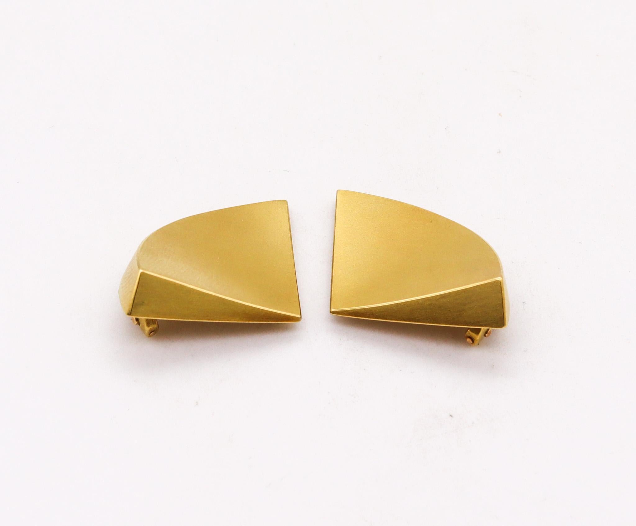 Pair of geometric clips earrings.

Beautiful pair of sculptural earrings, created in the north Europe region, back in the 1990. These earrings are most probably crafted by a German designer following the artistic parameters of the Bauhaus movement.