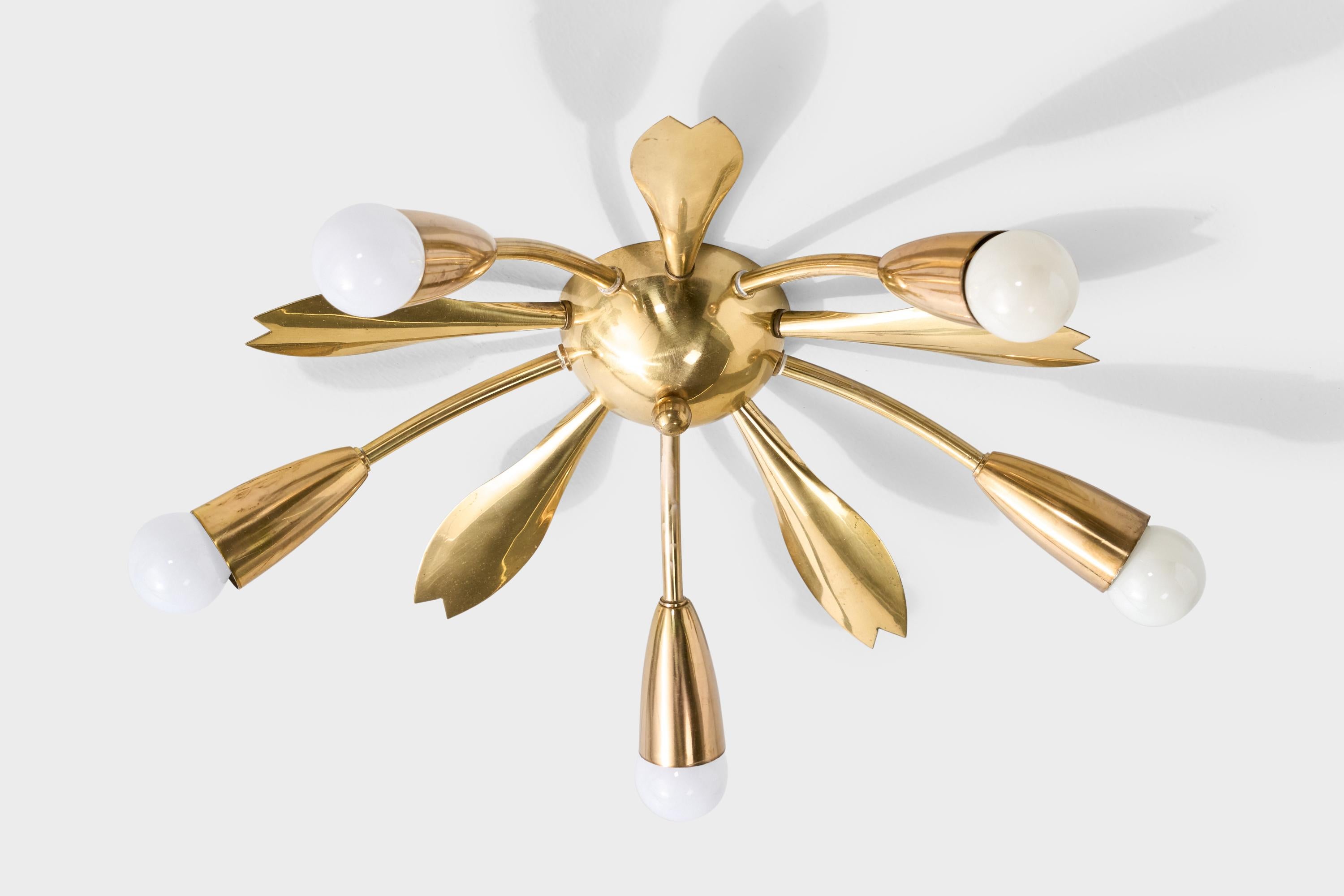 A brass chandelier or wall light likely designed and produced in Germany, c. 1950s.

Overall Dimensions (inches): 5.5” H x 18” Diameter

Dimensions of Canopy: 2” H x 4” Diameter

Bulb Specifications: E-14 frosted round 

Number of Sockets: 5

All