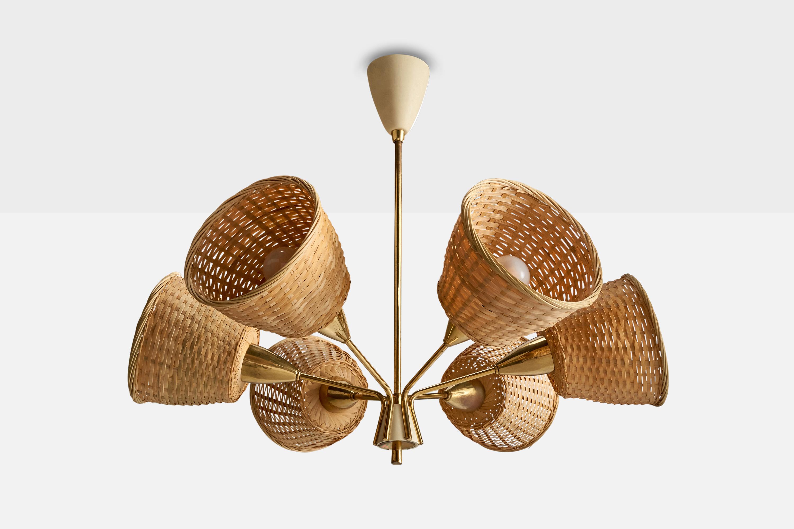 A brass, white-lacquered metal and rattan chandelier designed and produced in Germany, c. 1950s.

Assorted rattan lampshades.

Overall Dimensions (inches): 22.5” H x 27” Diameter
Dimensions of Canopy:  4.75” H x 3.625” W x 3.625” D
Stem length: