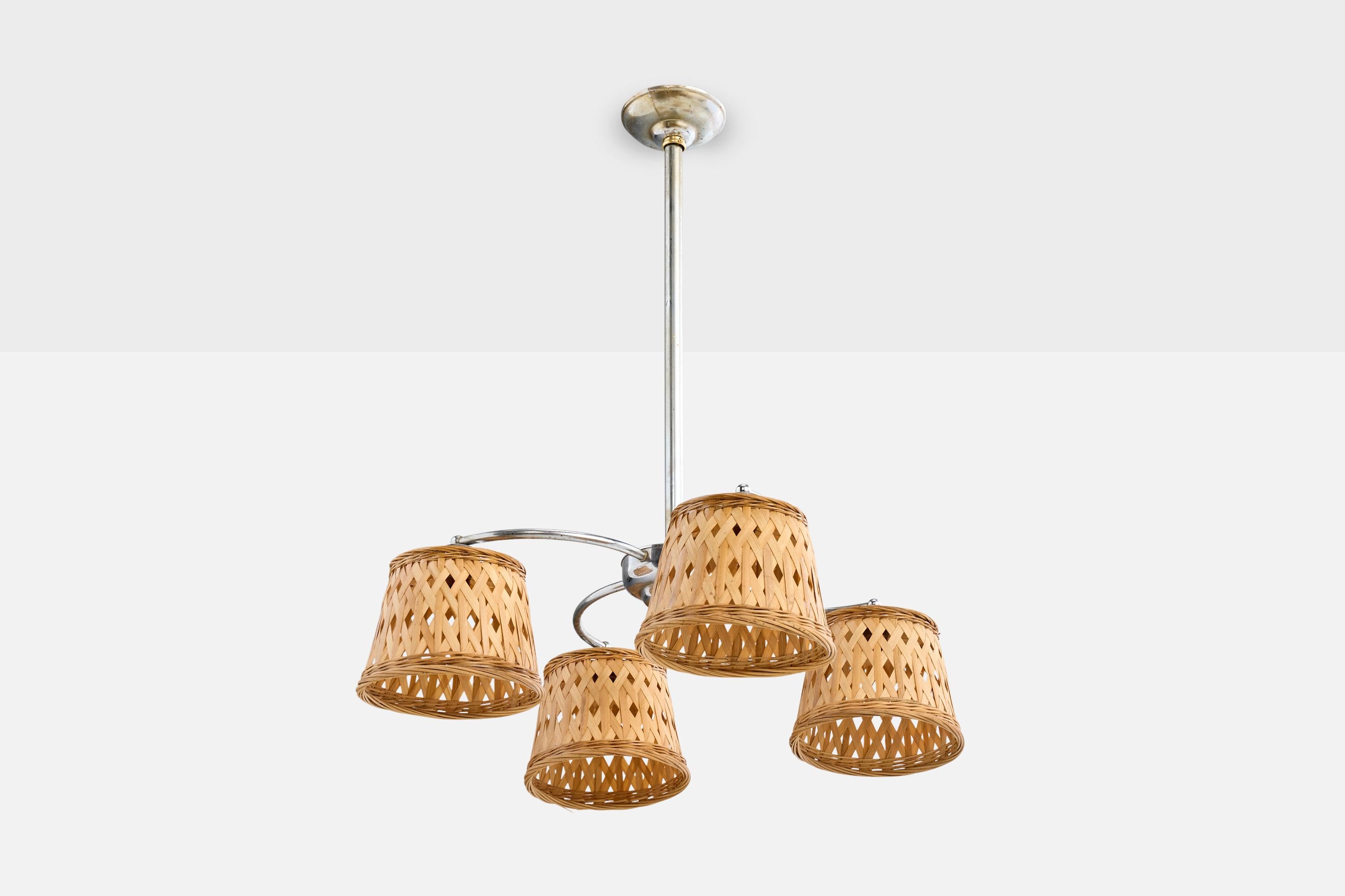 A chrome-plated metal and rattan chandelier designed and produced in Germany, c. 1920s.

The metal stem and arms present with light oxidation. Replaced lampshades.

Overall Dimensions (inches): 31” Height x 24” Diameter

Dimensions of Canopy