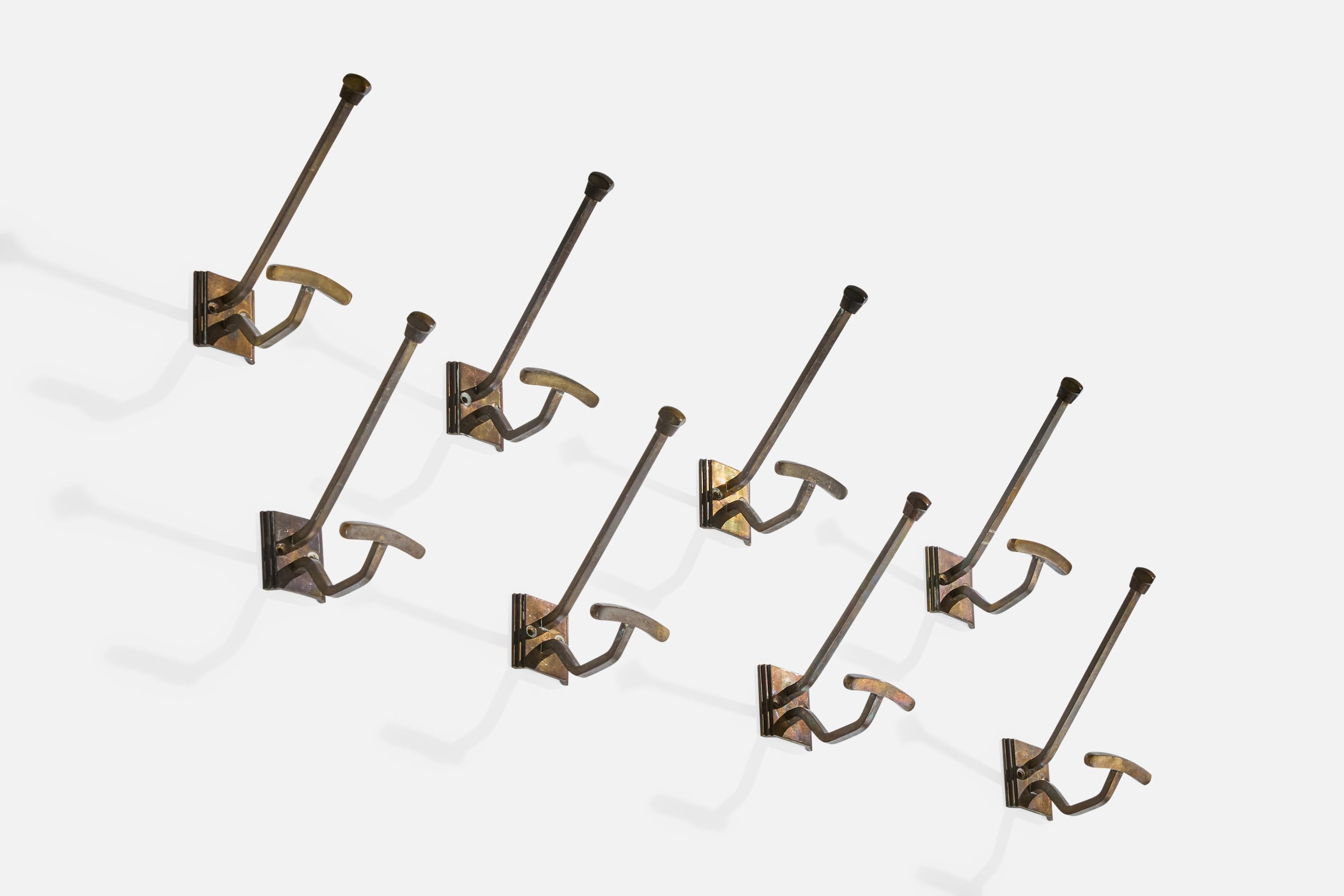 A set of 8 brass coat hangers likely designed and produced in Germany, 1920s.

Overall Dimensions (inches): 6.4