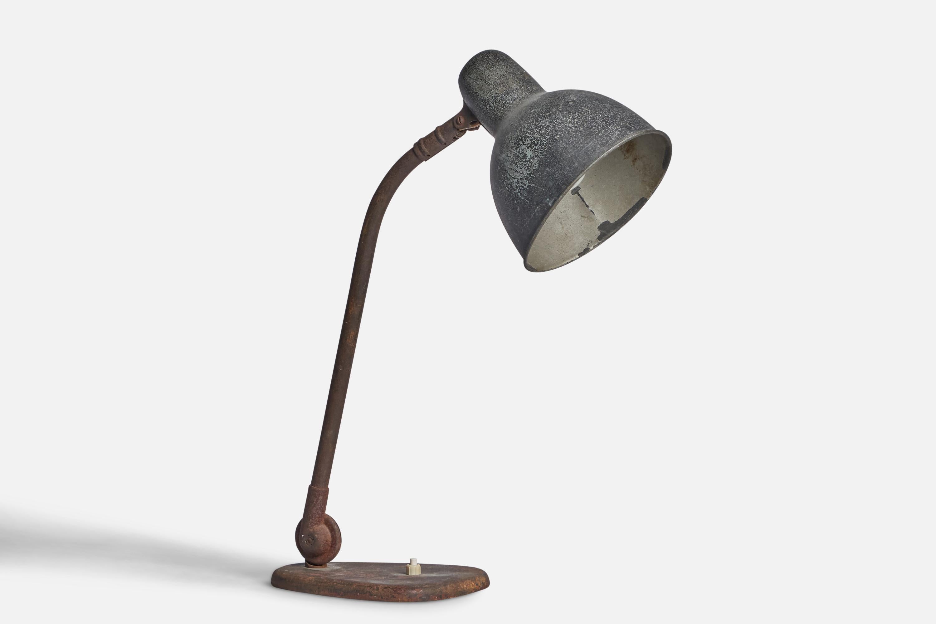 An adjustable metal table lamp designed and produced in Germany, 1930s.

Dimensions of Lamp (inches): 18.9” H x 5.8” W x 13.25” D
Dimensions variable based on position of light
Bulb Specifications: E-26 Bulb
Number of Sockets: 1
All lighting will be
