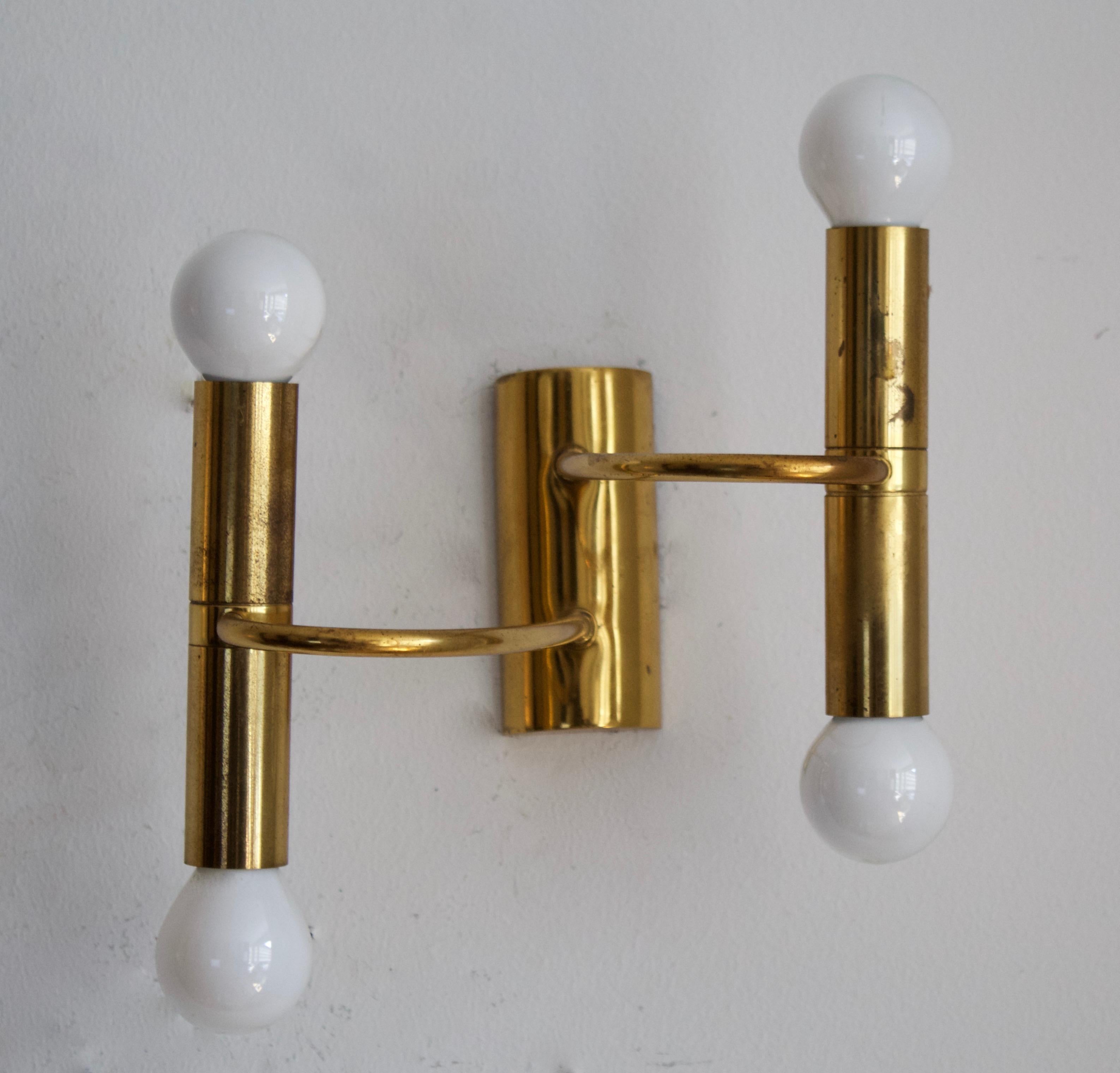 A pair of two-armed wall lights. Designed and produced in Germany, c. 1960s.

 