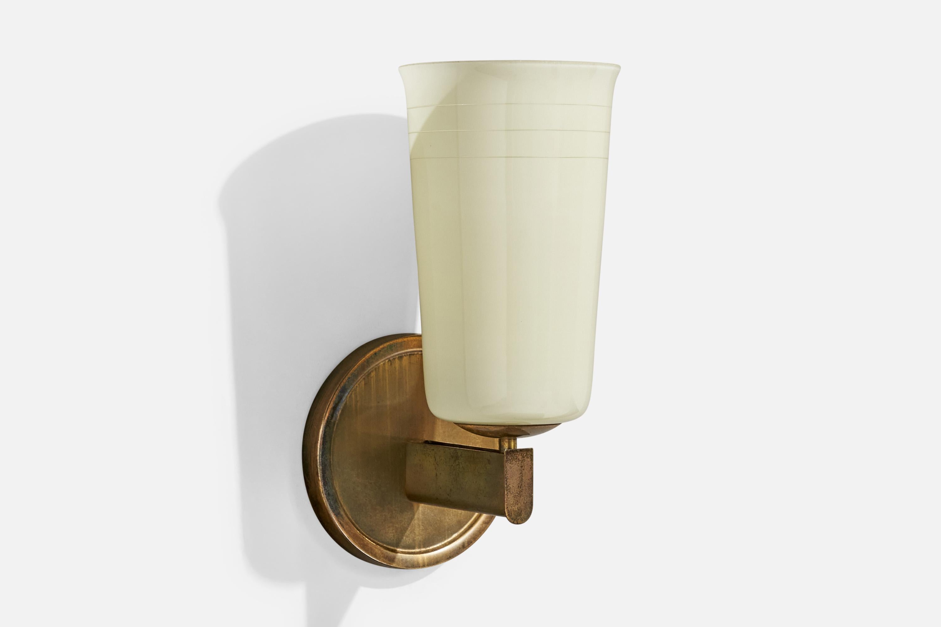 A brass and white opaline glass wall light designed and produced in Germany, c. 1920s.

Overall Dimensions (Inches): 13.375” H x 6.375” W x 7.5“ D

Back Plate Dimensions (Inches): 6.375” H x 6.375“ W x 1” D

Bulb Specifications: E-26

Number of