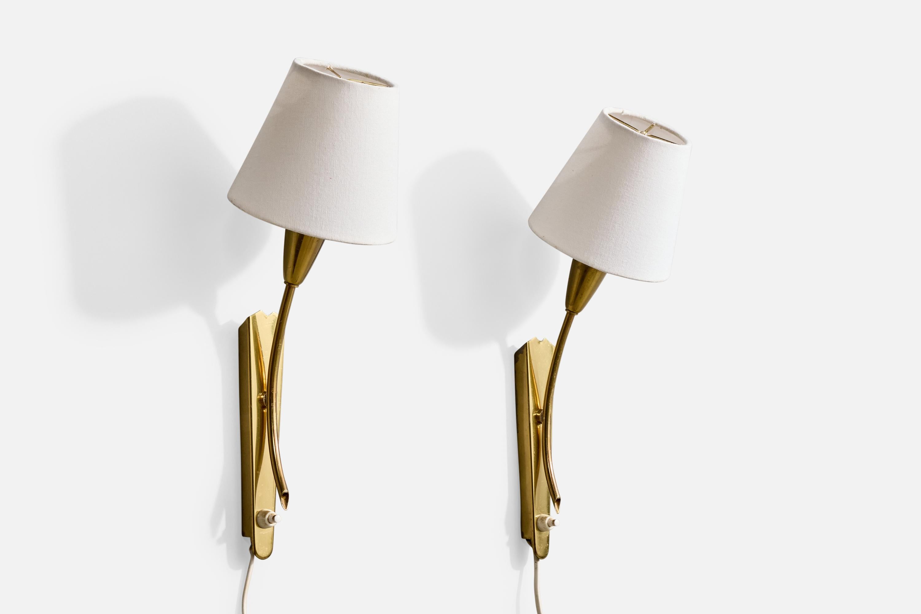 A pair of brass and white fabric wall lights likely designed and produced in Germany, c. 1960s.

Overall Dimensions (Inches): 15.5
