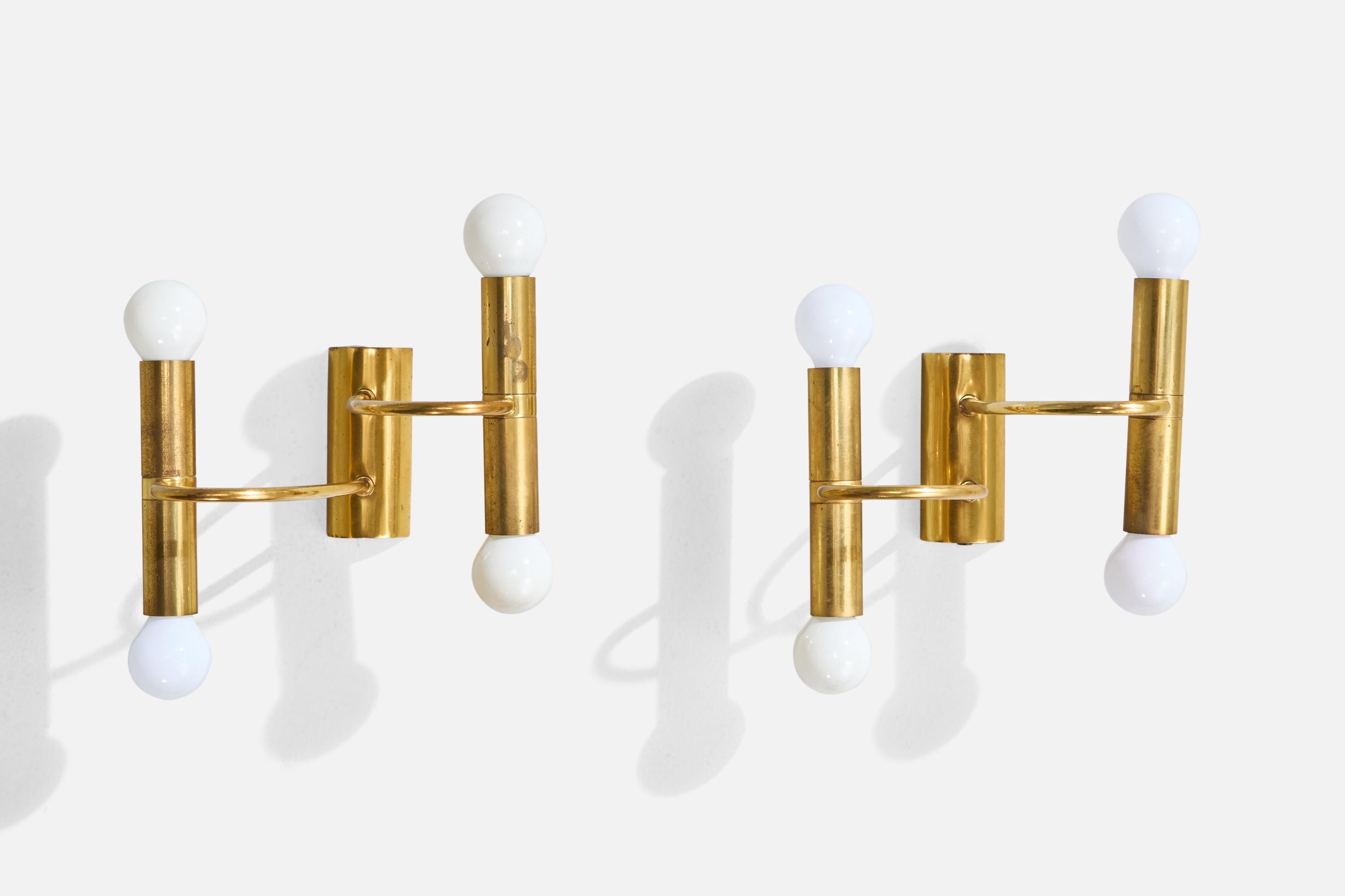 A pair of brass wall lights designed and produced in Germany, c. 1960s.

Light oxidation present throughout both brass fixtures.

Overall Dimensions (Inches): 10” H x 9” W x 6.2“ D

Back Plate Dimensions (Inches): 4.5” H x 2“ W x 1” D

Bulb