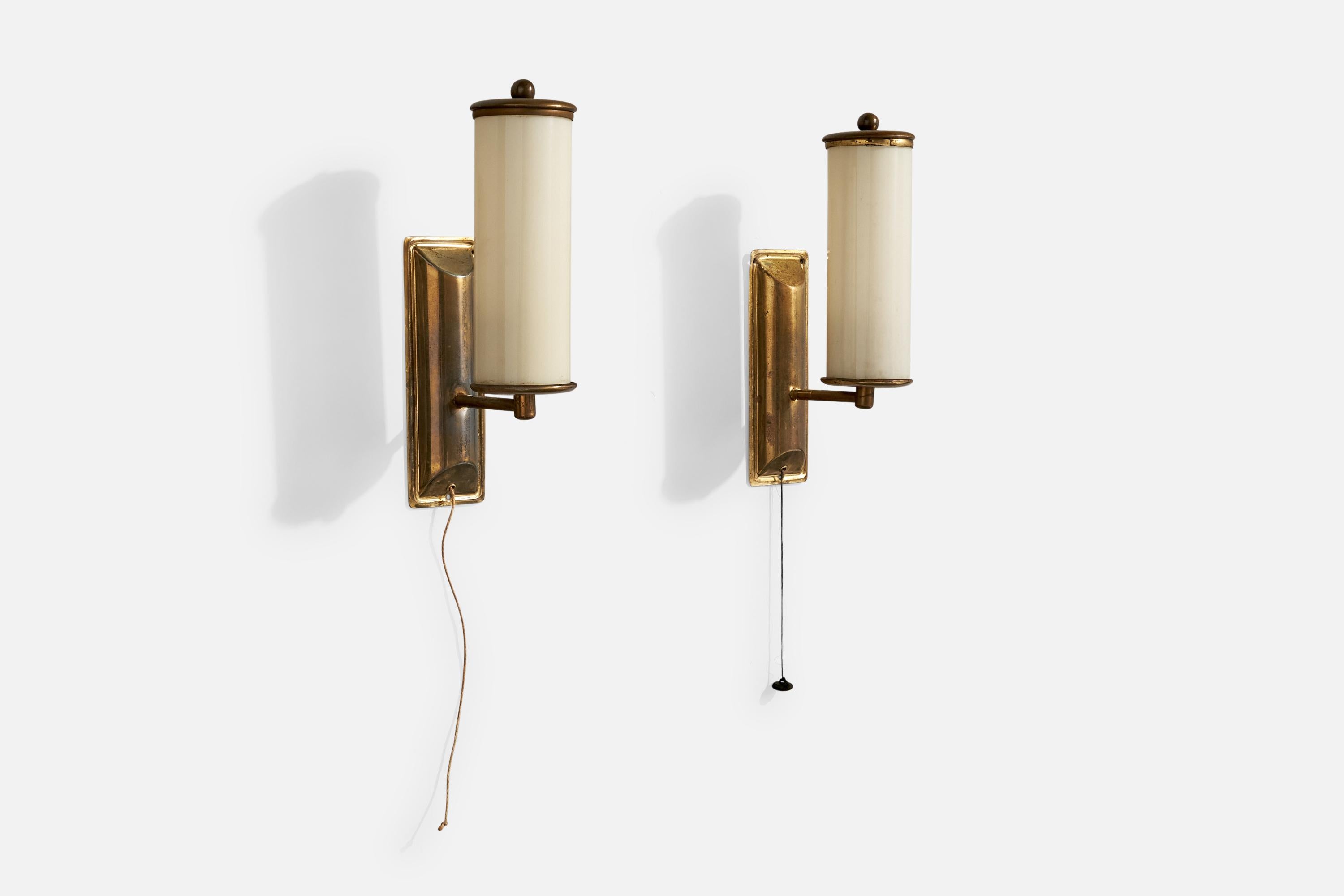A pair of brass and off-white opaline glass wall lights designed and produced in Germany, c. 1920s.

Overall Dimensions (Inches): 10.4” H x 2.4” W x 3.7“ D

Back Plate Dimensions (Inches): 6.5” H x 2.4“ W x .75” D

Bulb Specifications: E-14

Number