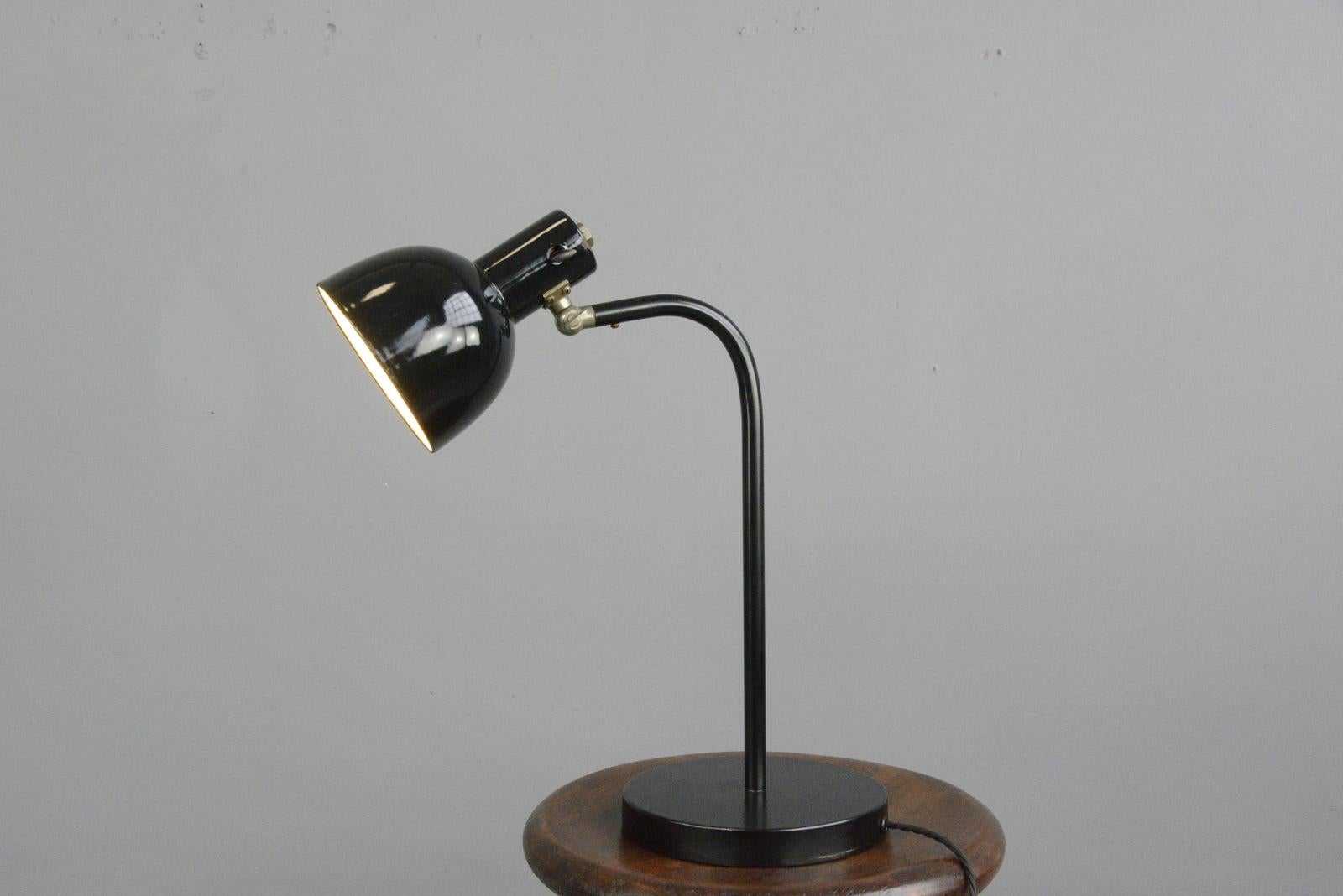 German desk lamp, circa 1930s

- Curved steel arm
- Cast iron foot
- Vitreous black enamel shade
- Takes E27 fitting bulbs
- Original toggle On/Off switch on the shade,
- German, 1930s
- Measures: 46cm tall x 36cm deep x 19cm