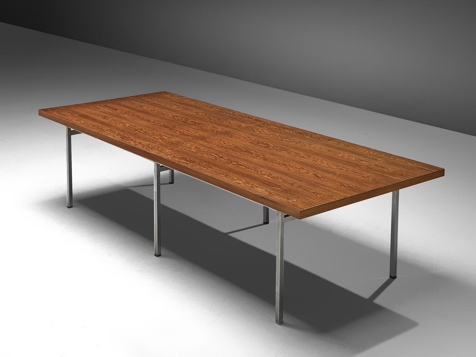 Dining table, rosewood and chromed steel, Germany, 1960s

This modern dining table features a rosewood table top and a chromed steel frame. The frame is executed in thin legs that and a frame that holds up the table top by only a some support