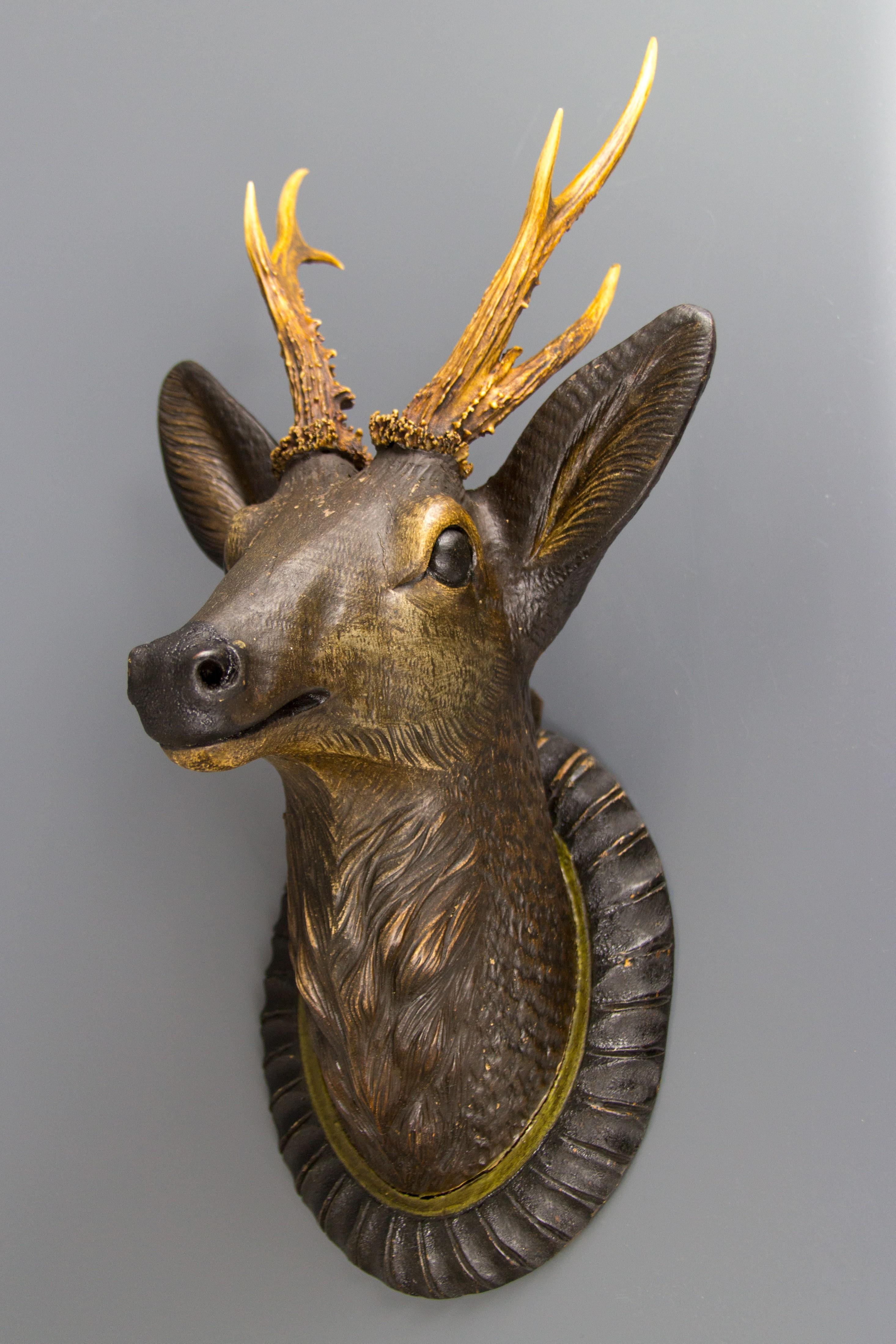 deer with head on antlers