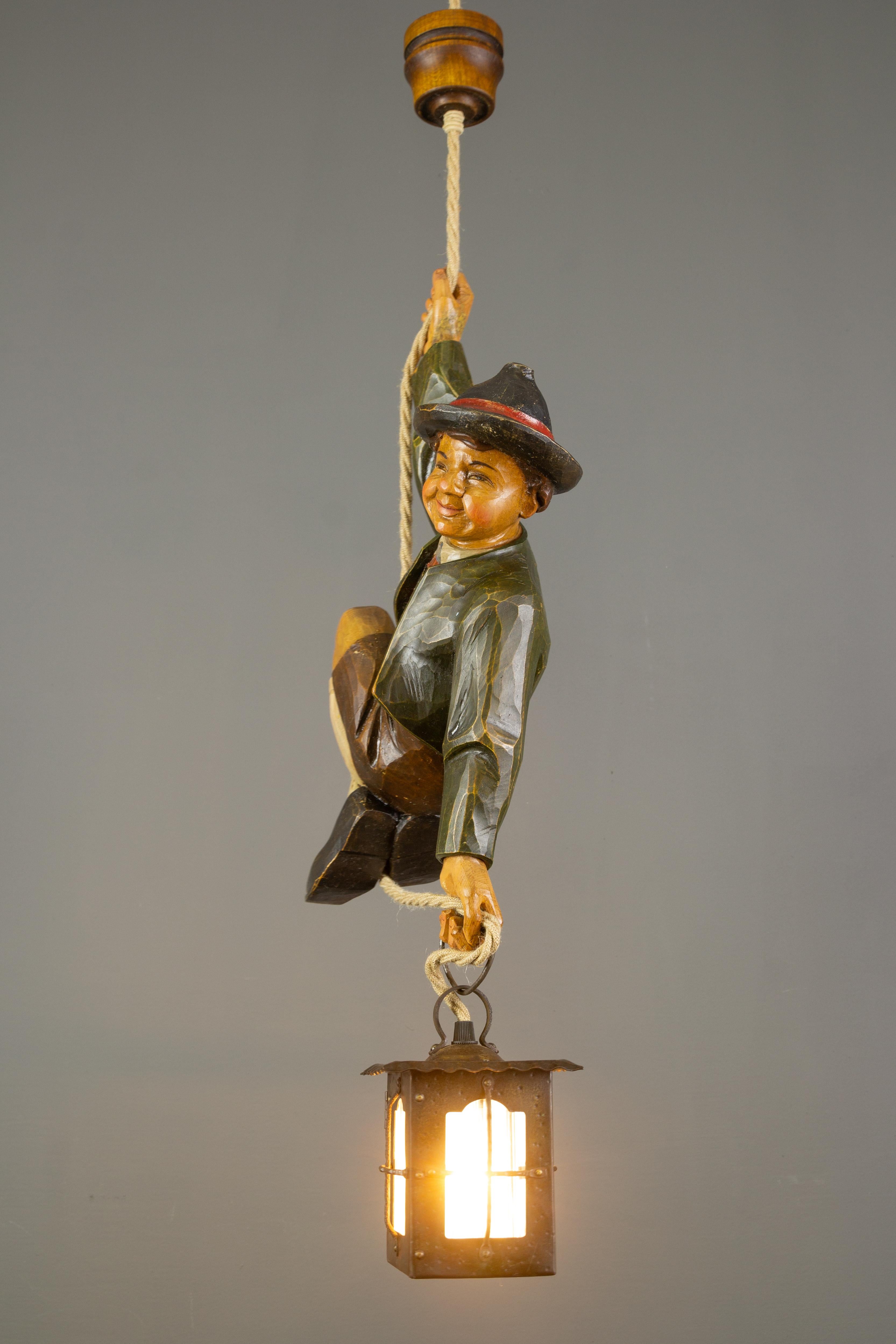 Wood German Hanging Lamp with Hand Carved Sculpture of Mountain Climber and a Lantern
