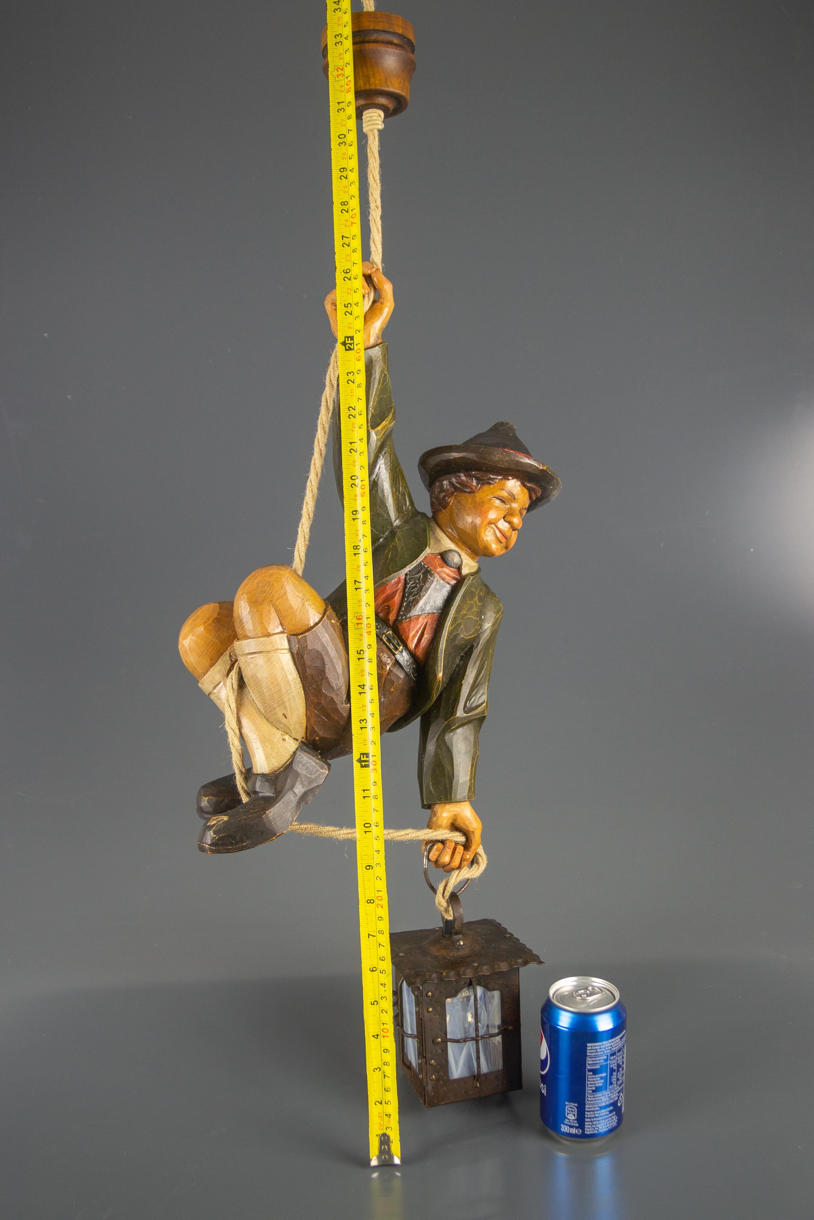 German Hanging Lamp with Hand Carved Sculpture of Mountain Climber and a Lantern 5
